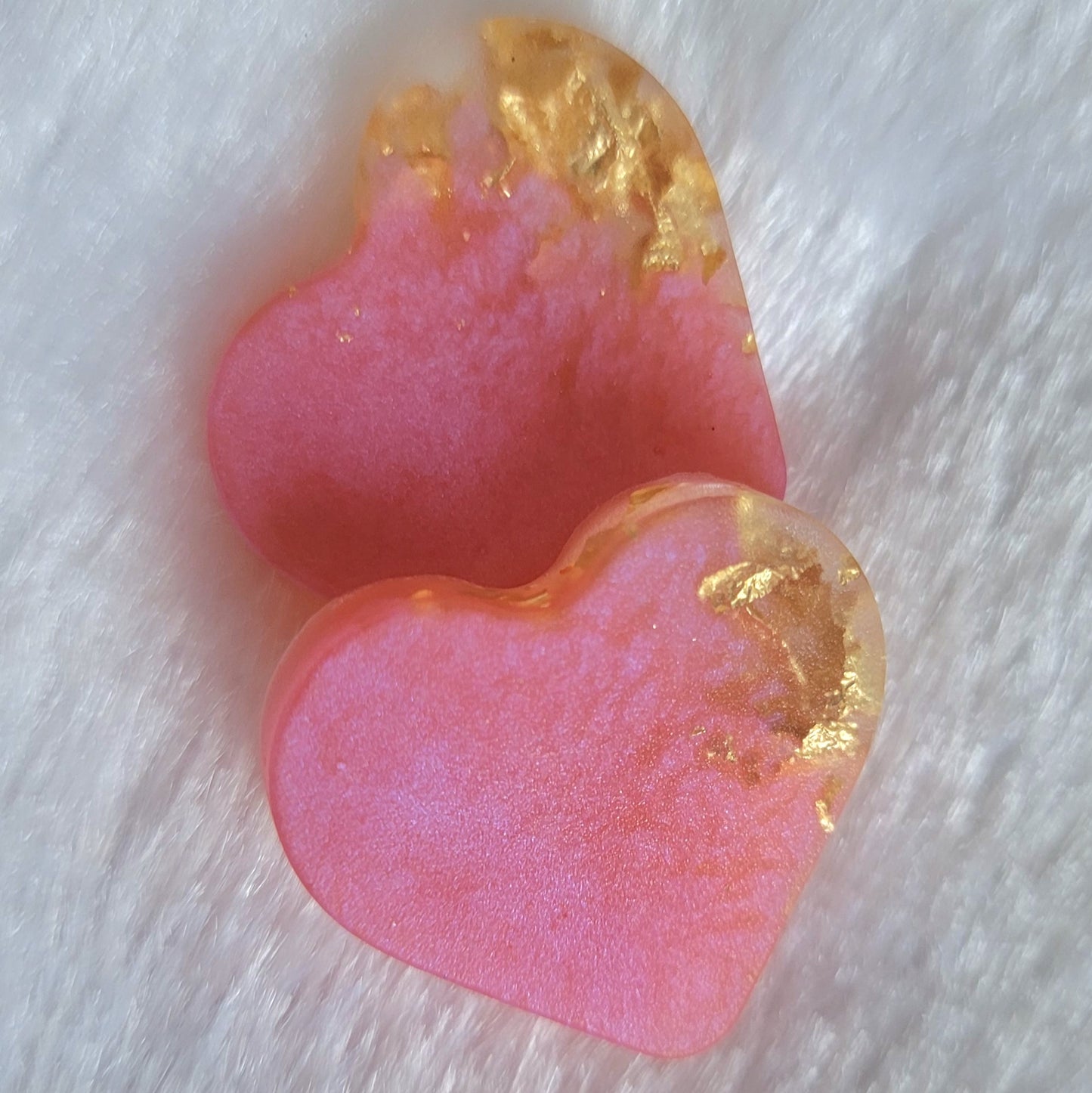 Mini heart shaped epoxy resin pieces, light pink shimmery pigment with gold foil flakes.