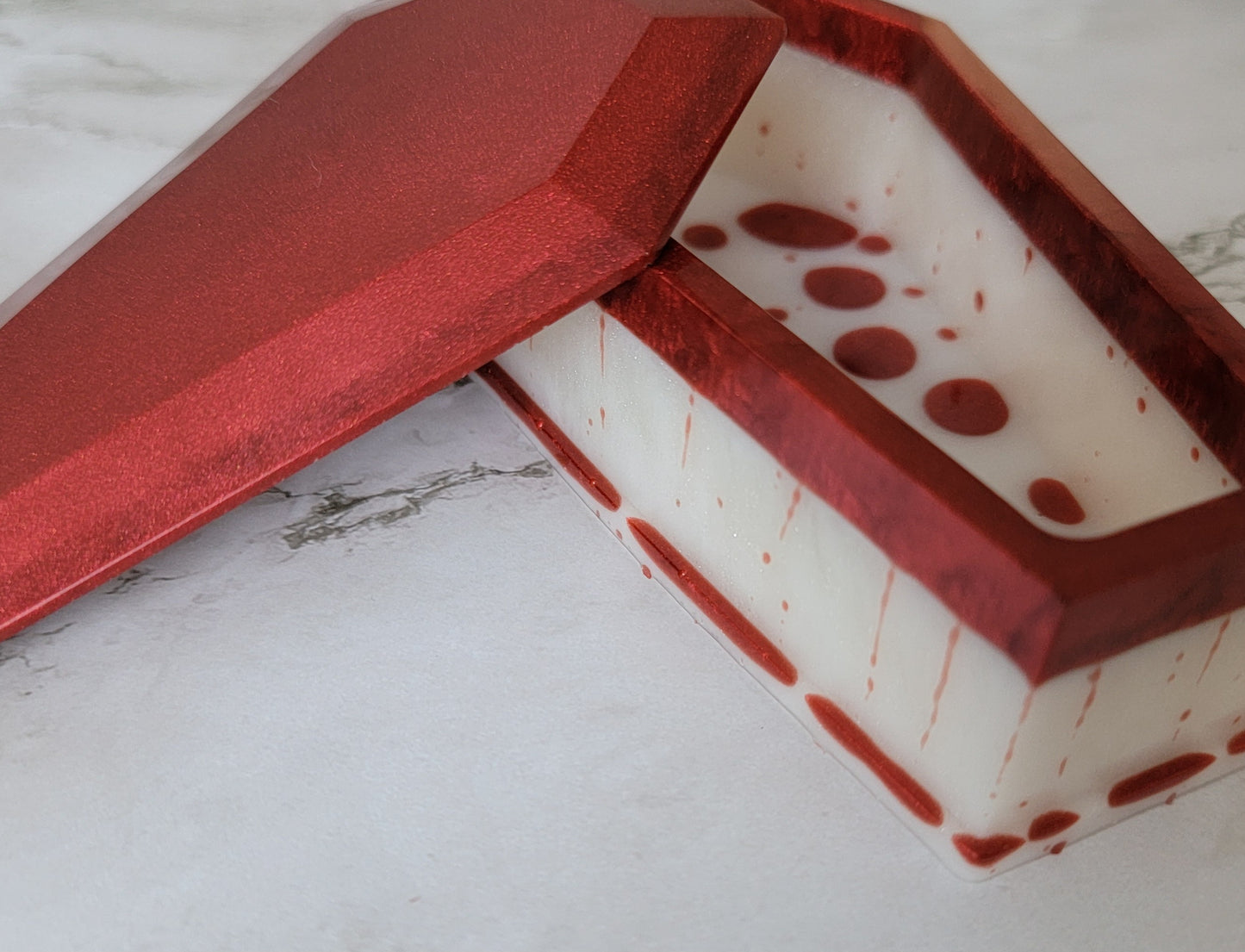 Coffin shaped epoxy resin trinket box, red and white blood drip design.