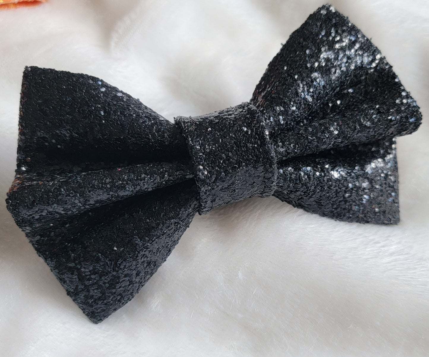 Black glitter canvas bow.