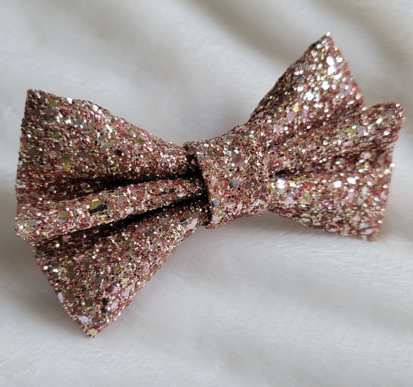 Rosey gold glitter canvas bow.