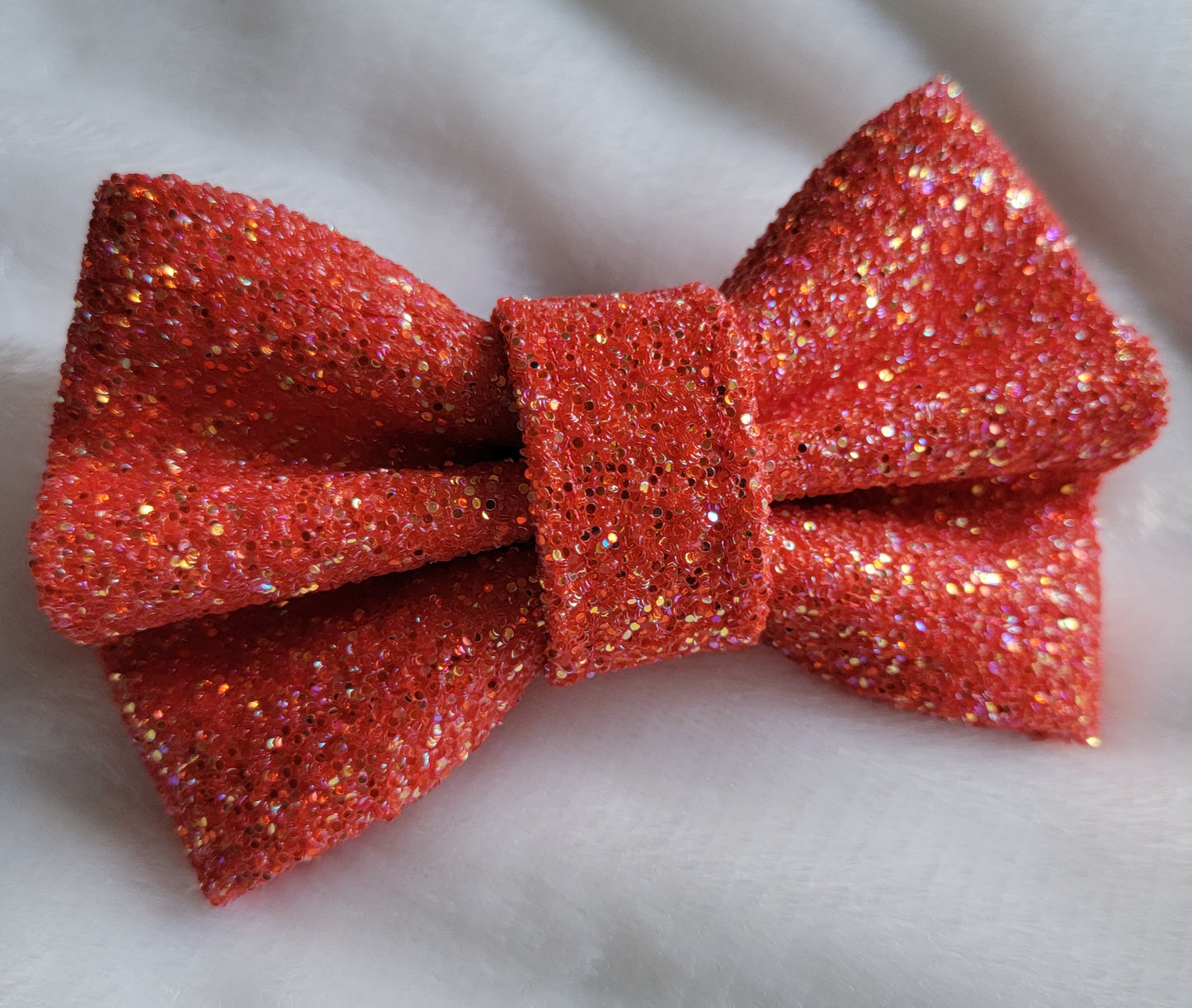 Bright orangey red glitter canvas bow.