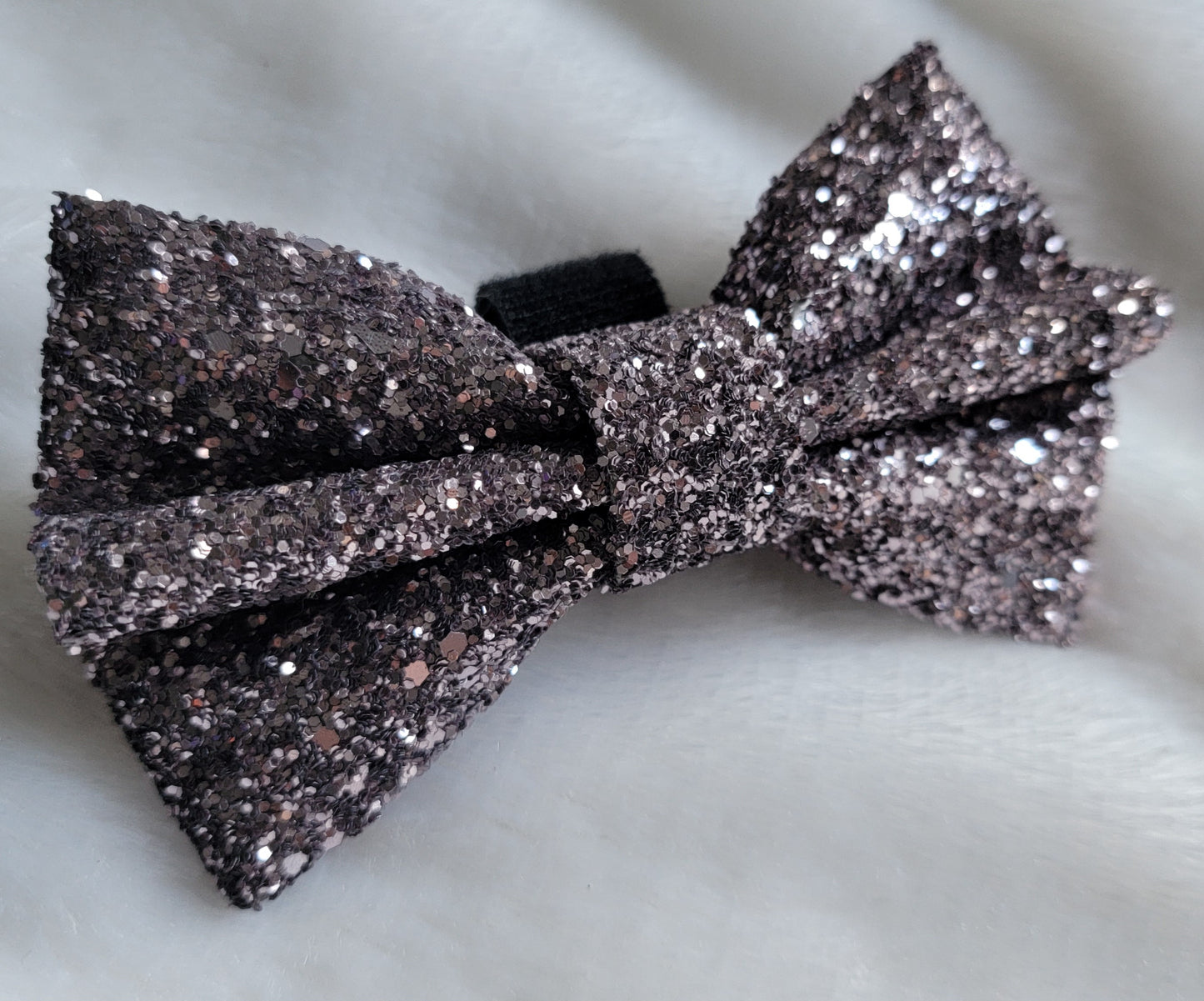 Dark pewter glitter canvas bow.