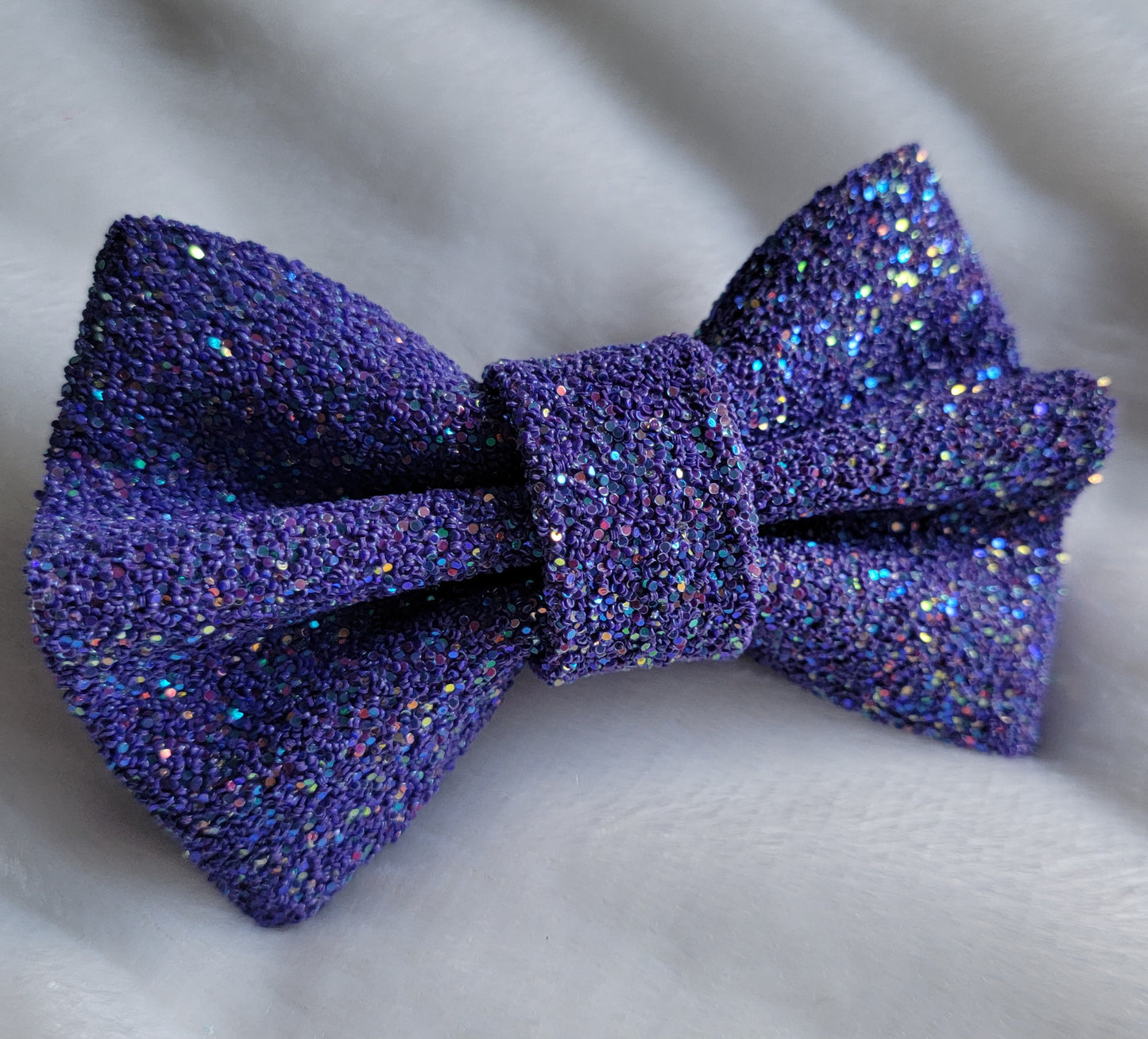 Dark iridescent violet glitter canvas bow.