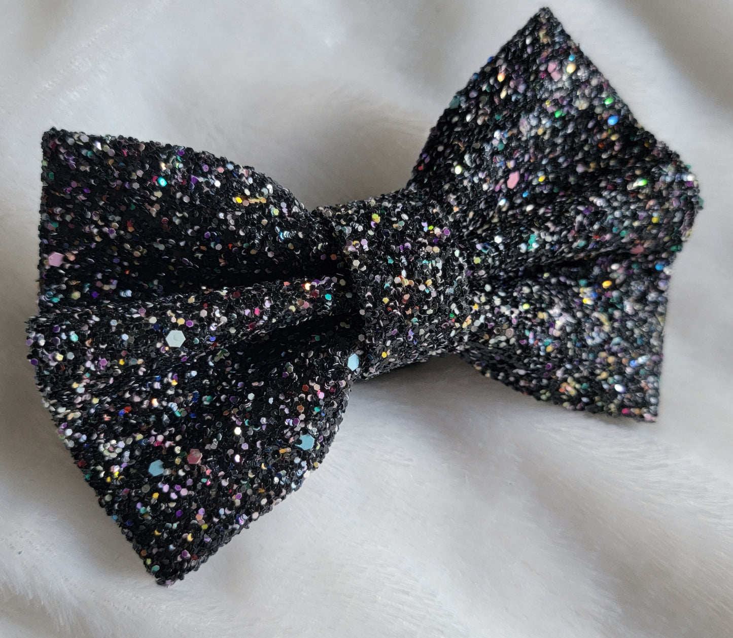 Black with multicolor confetti glitter canvas bow.