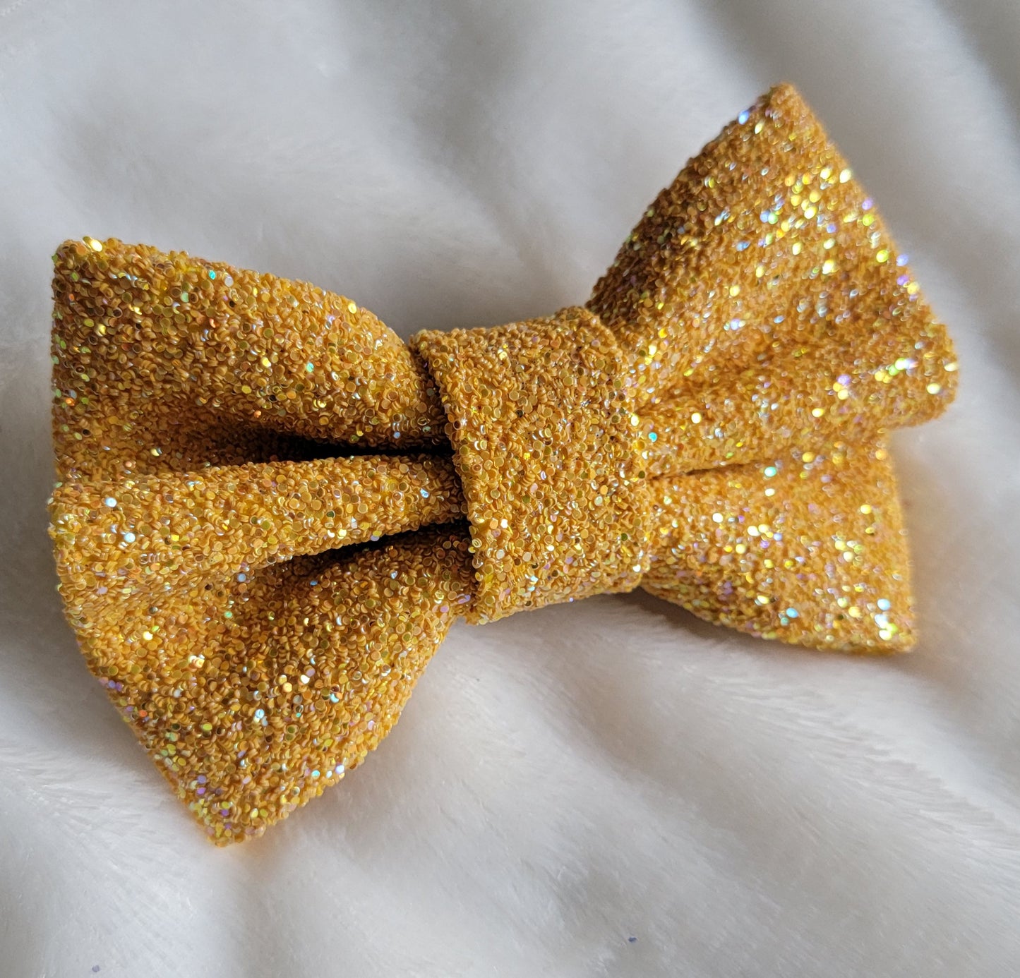Light iridescent orange glitter canvas bow.