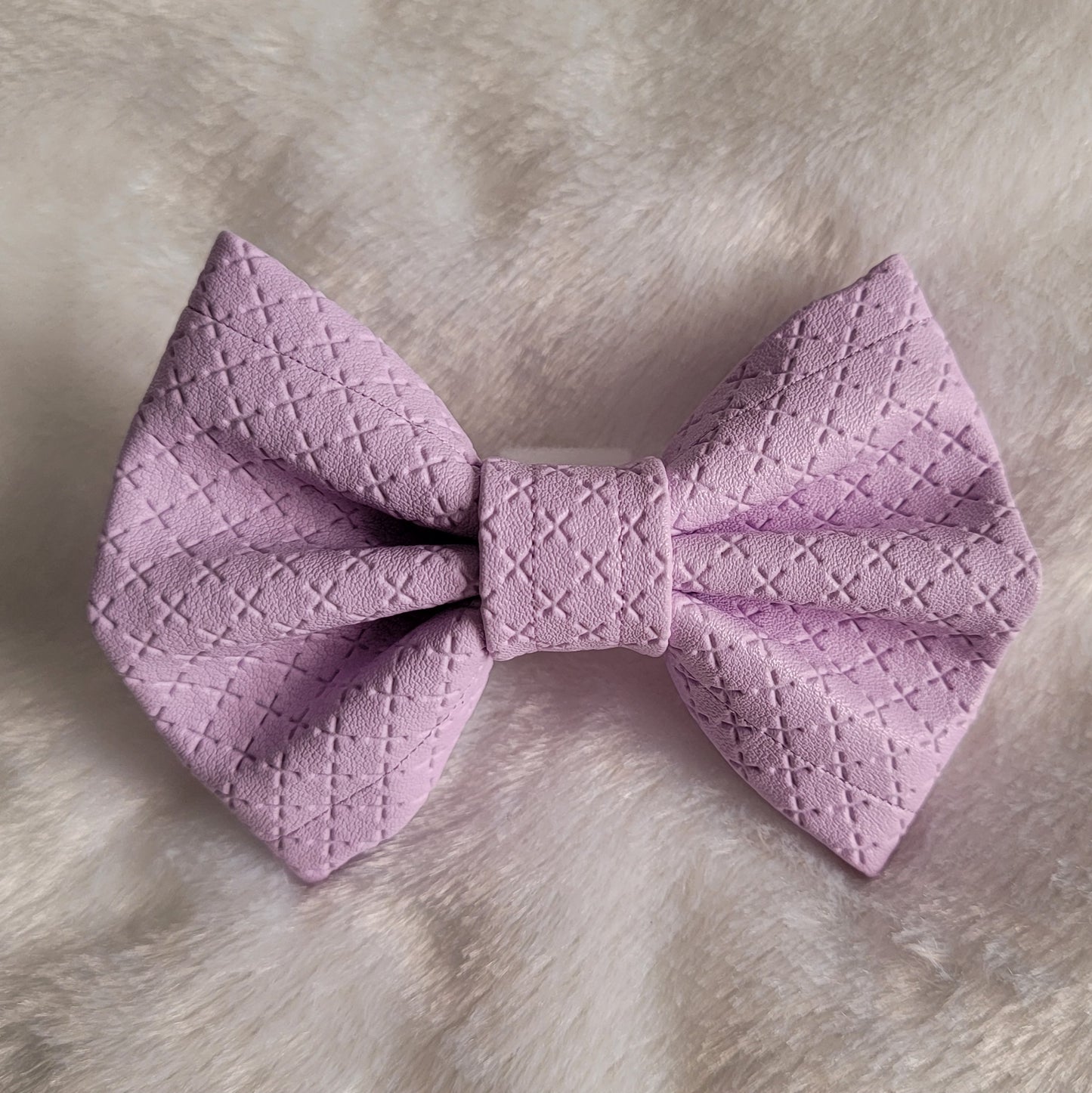 Lavender colored with crosshatch texture faux leather bowtie.