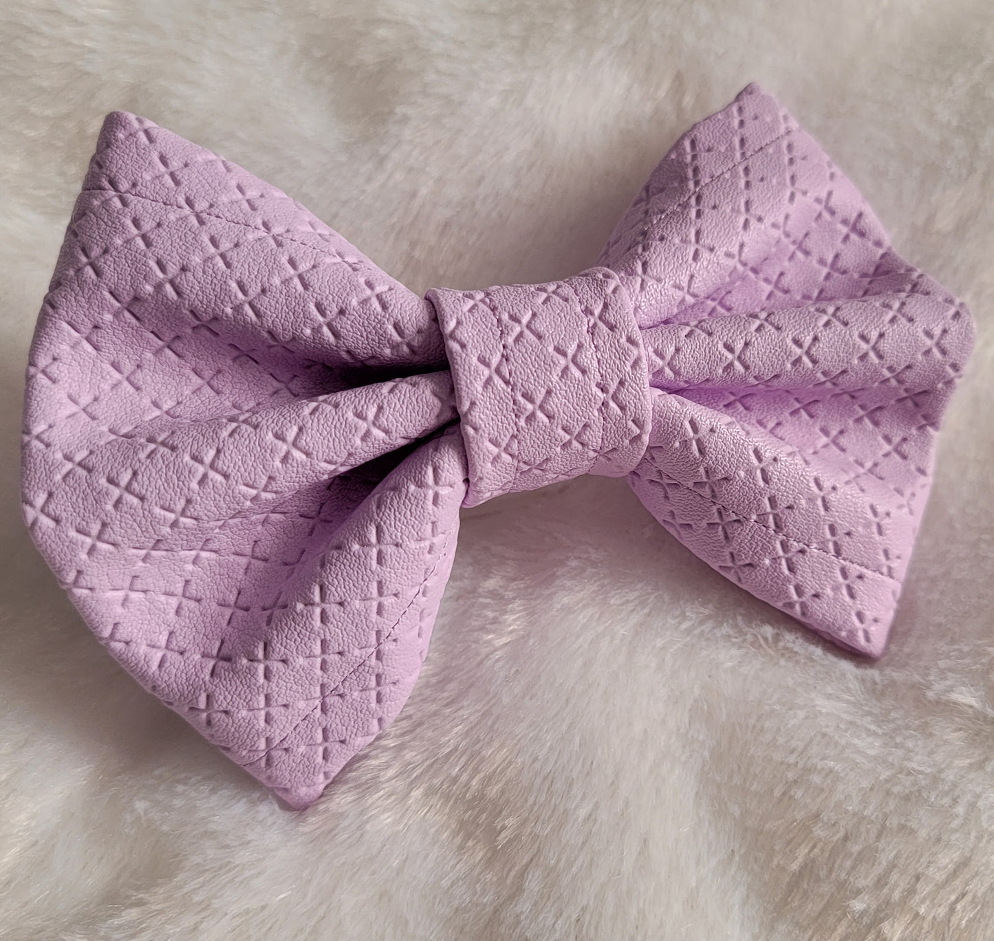 Lavender colored with crosshatch texture faux leather bowtie.