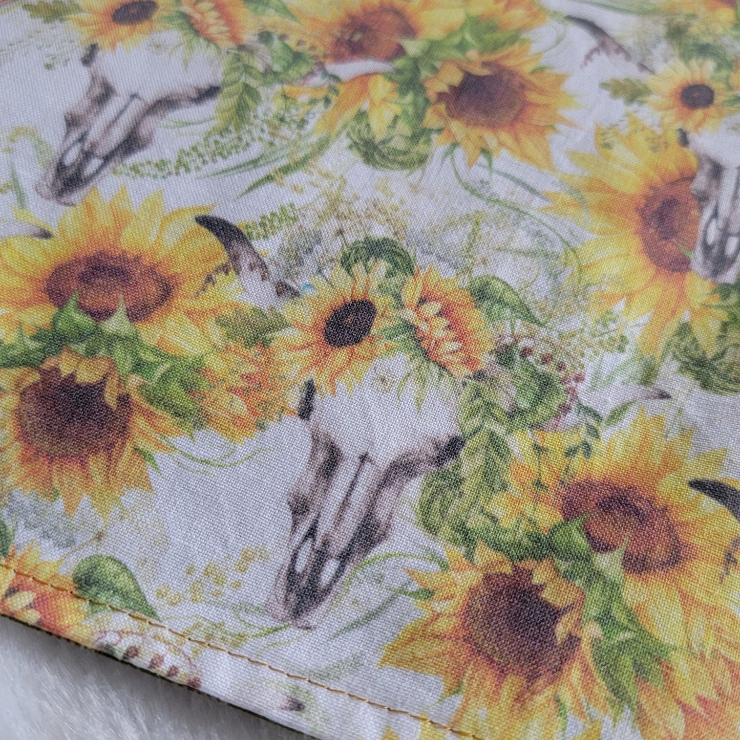Fabric with bull skulls and sunflowers on a white background