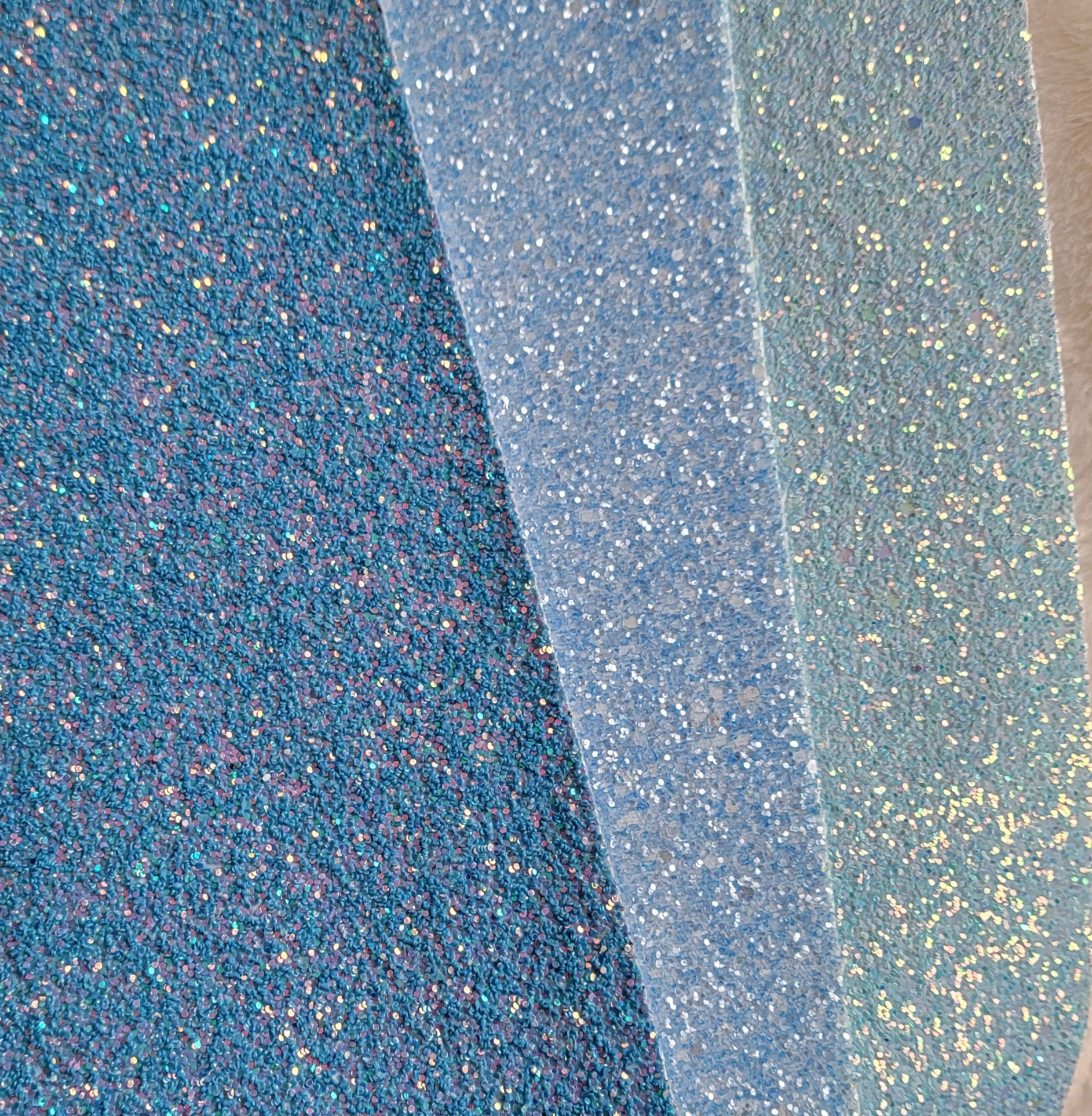 Three light blue glitter canvas options for making glitter bows.