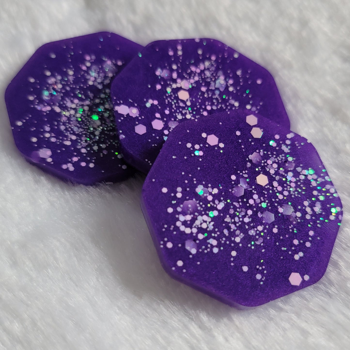 Octagon shaped epoxy resin pieces, bright violet with opal white glitter.