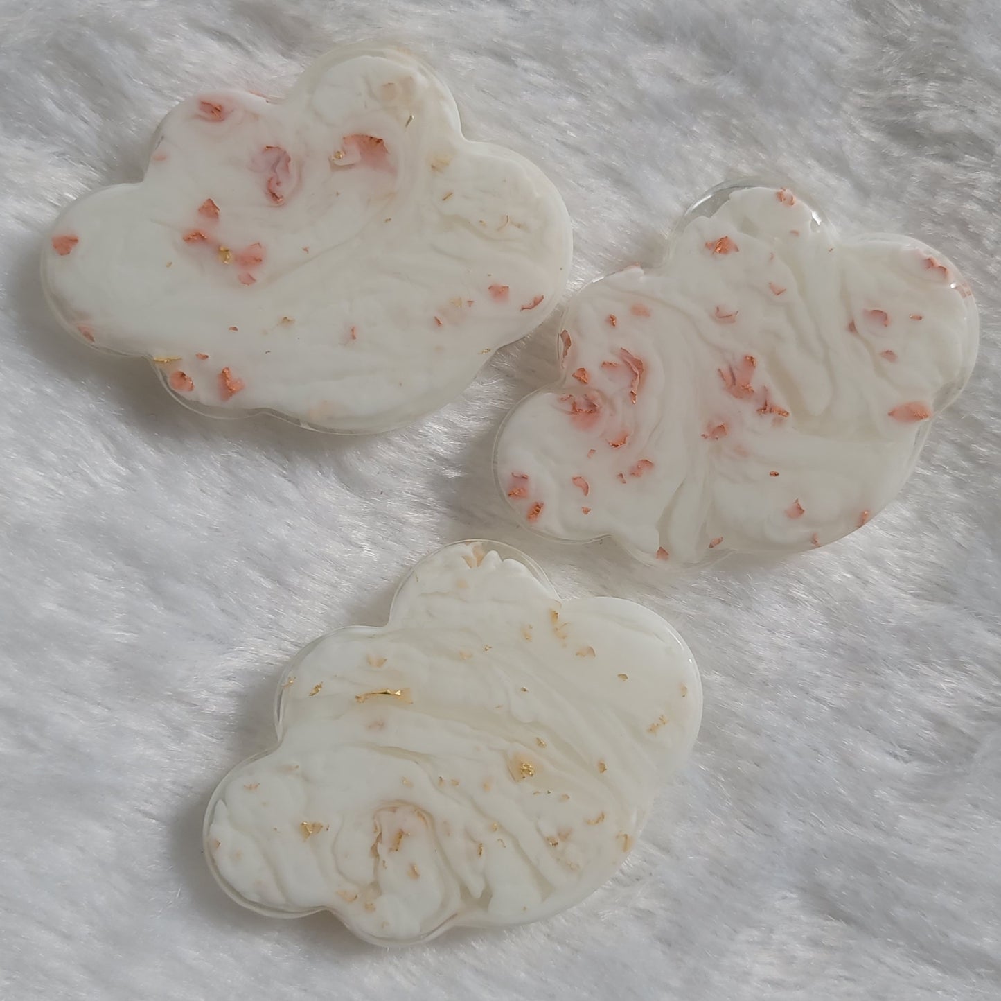 Cloud shaped epoxy resin pieces, white swirls with copper and gold foil flakes.