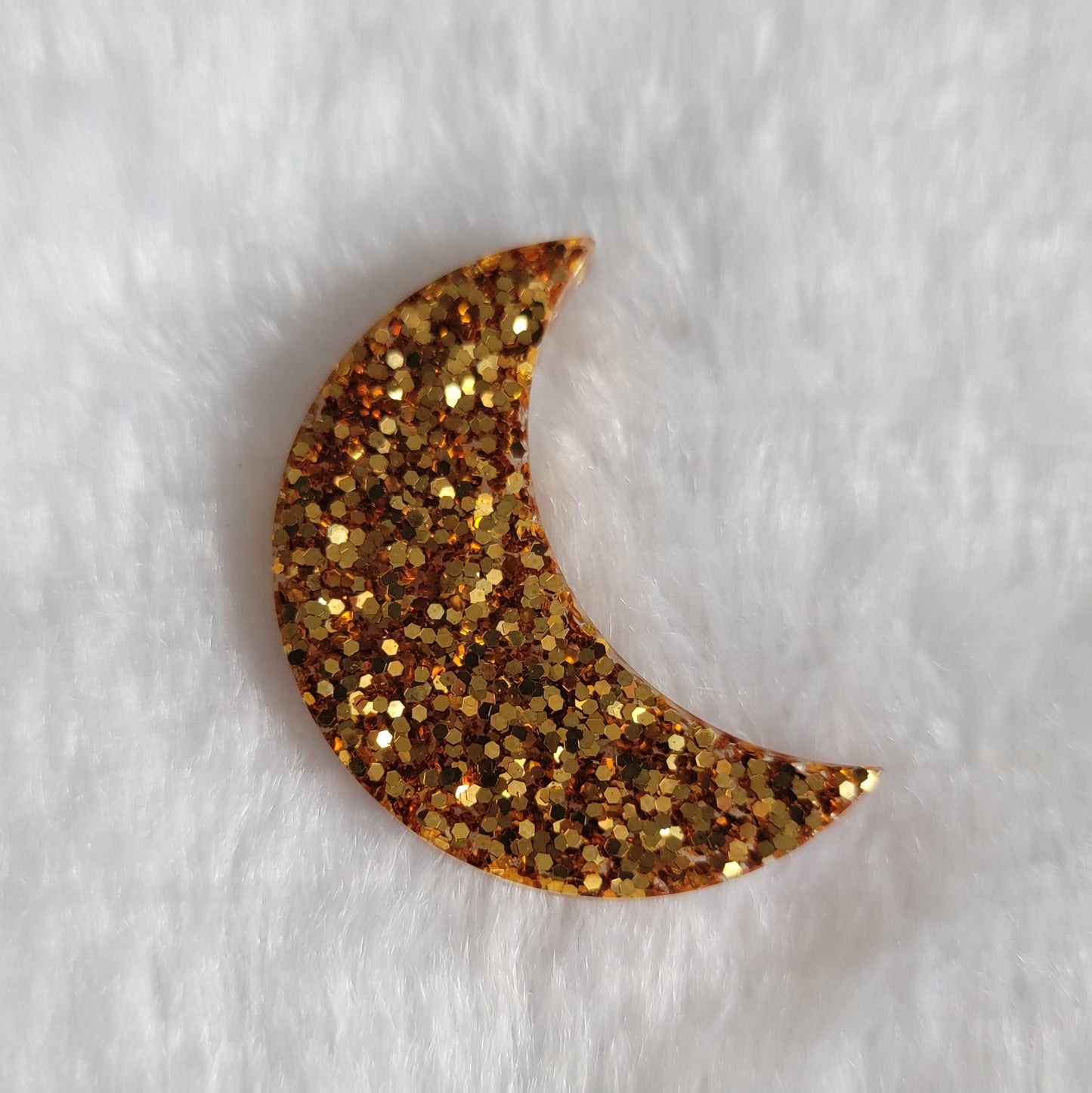 Crescent moon shaped epoxy resin piece, dark gold glitter.