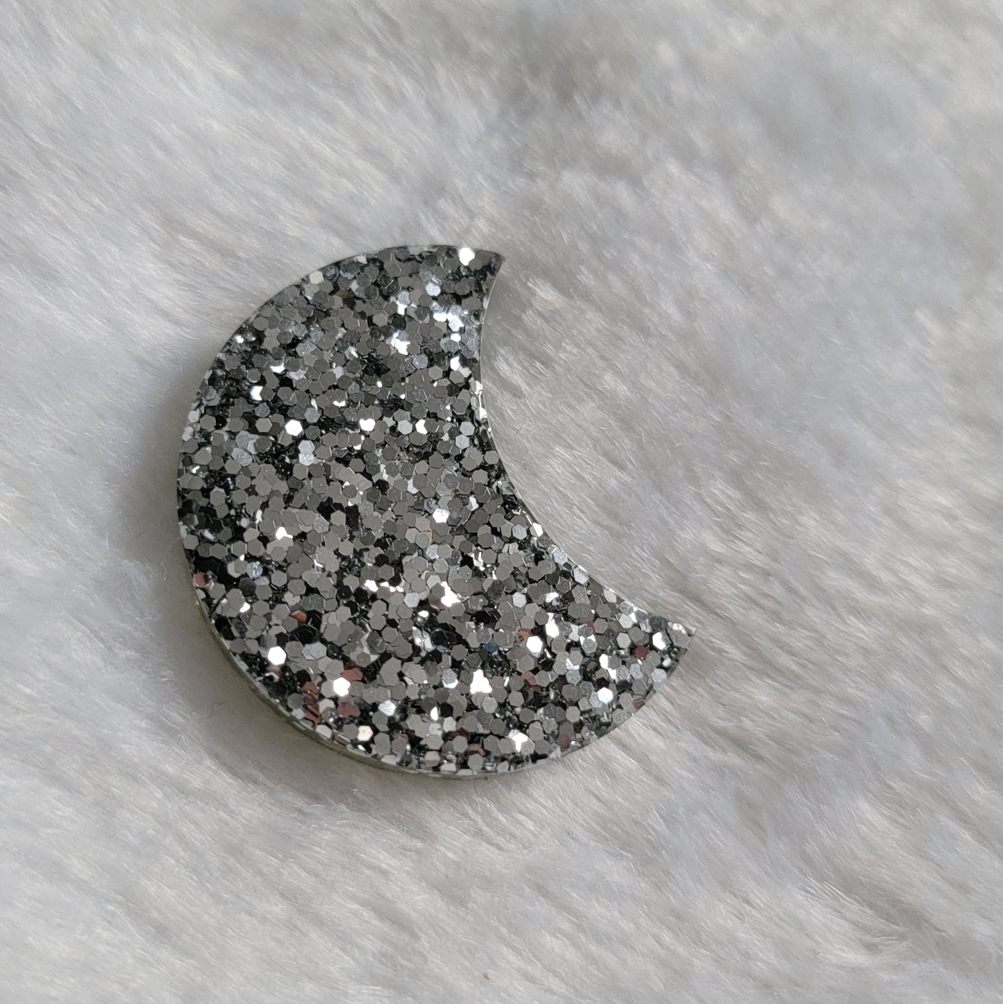 Thick crescent moon shaped epoxy resin piece, bright mercury silver glitter.