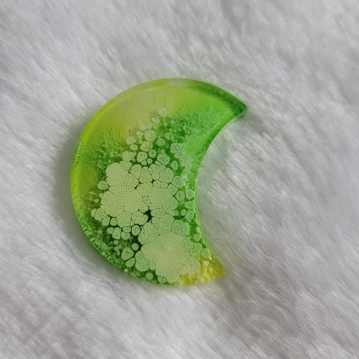 Thick crescent moon shaped epoxy resin piece, lime green and yellow ink drop style.