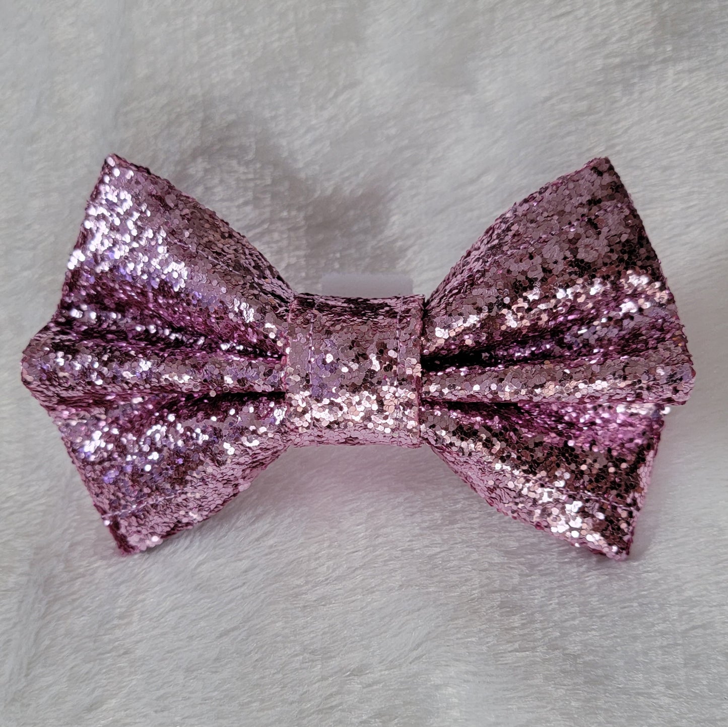 Pet bowtie made from lilac colored glitter canvas.