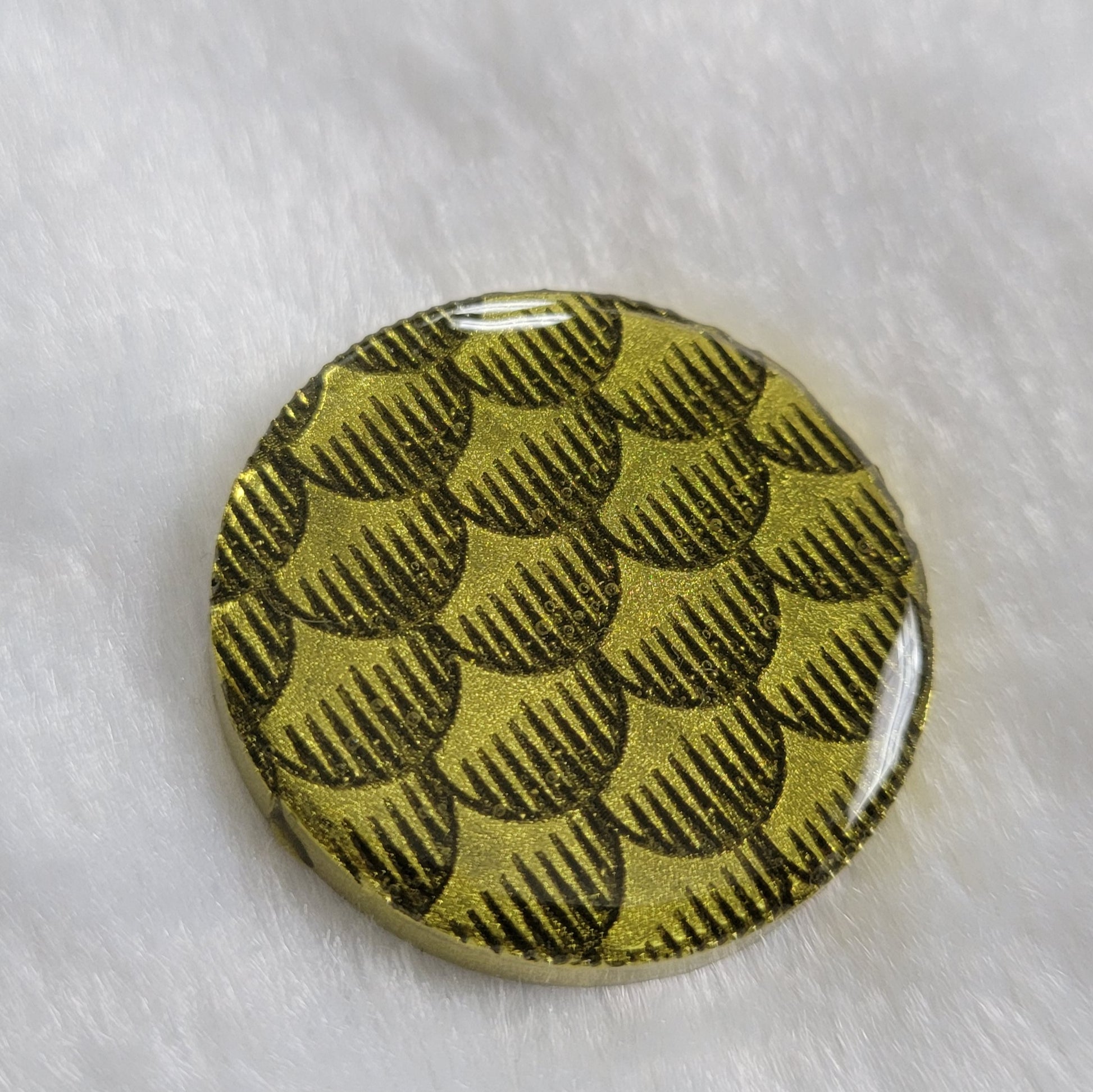 Round epoxy resin piece, bright metallic olive green fish scales design.