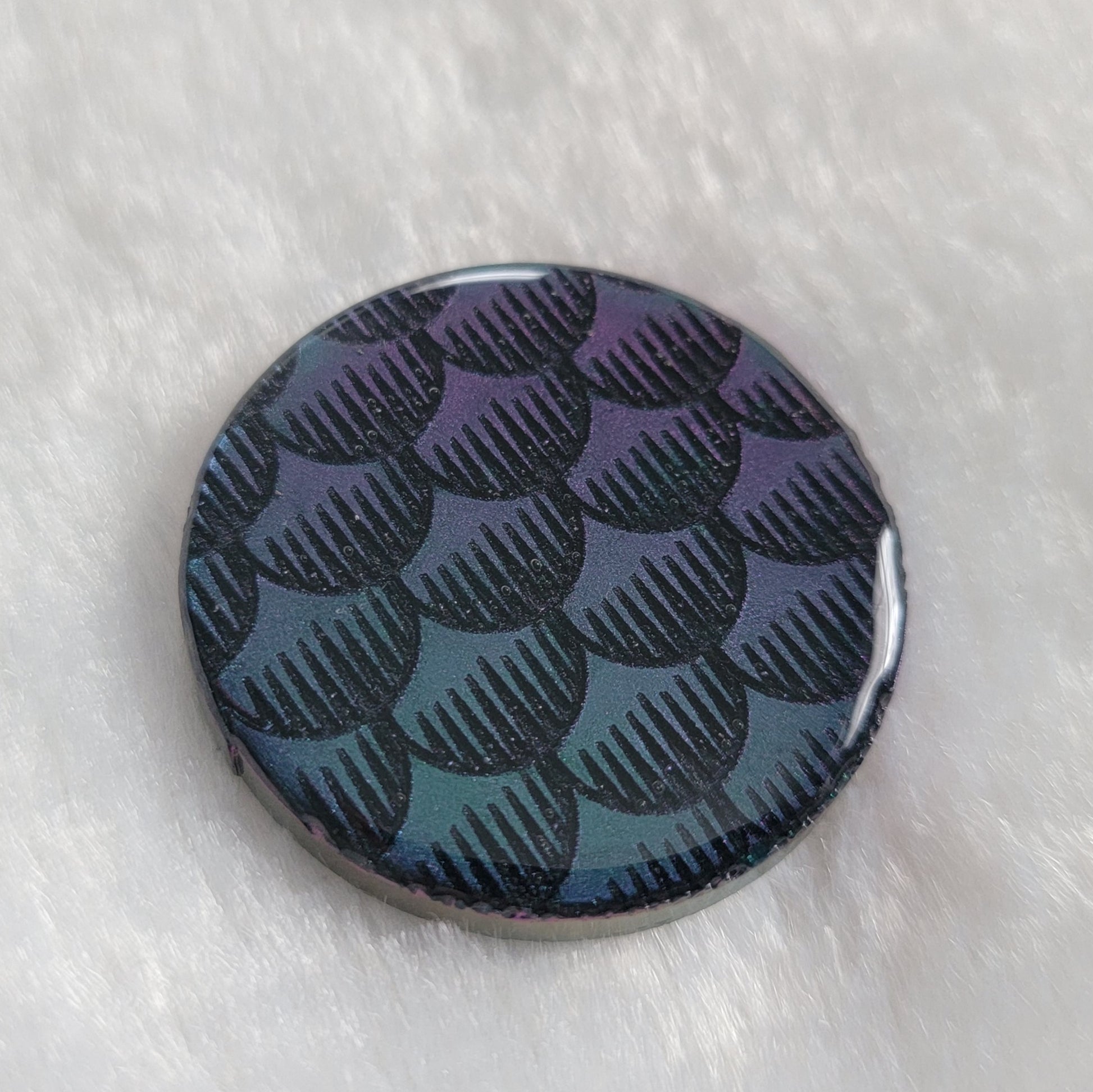 Teal and purple iridescent fish scales design epoxy resin piece.