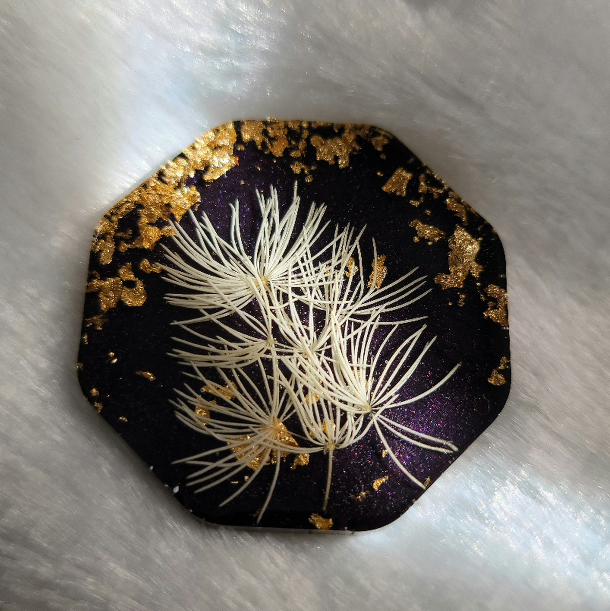 Octagon epoxy resin piece, dark purple with gold foil flake and white pom pom flowers.