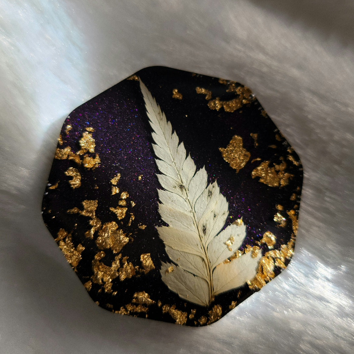 Octagon epoxy resin piece, dark purple with gold foil flake and white pom pom fern leaf.