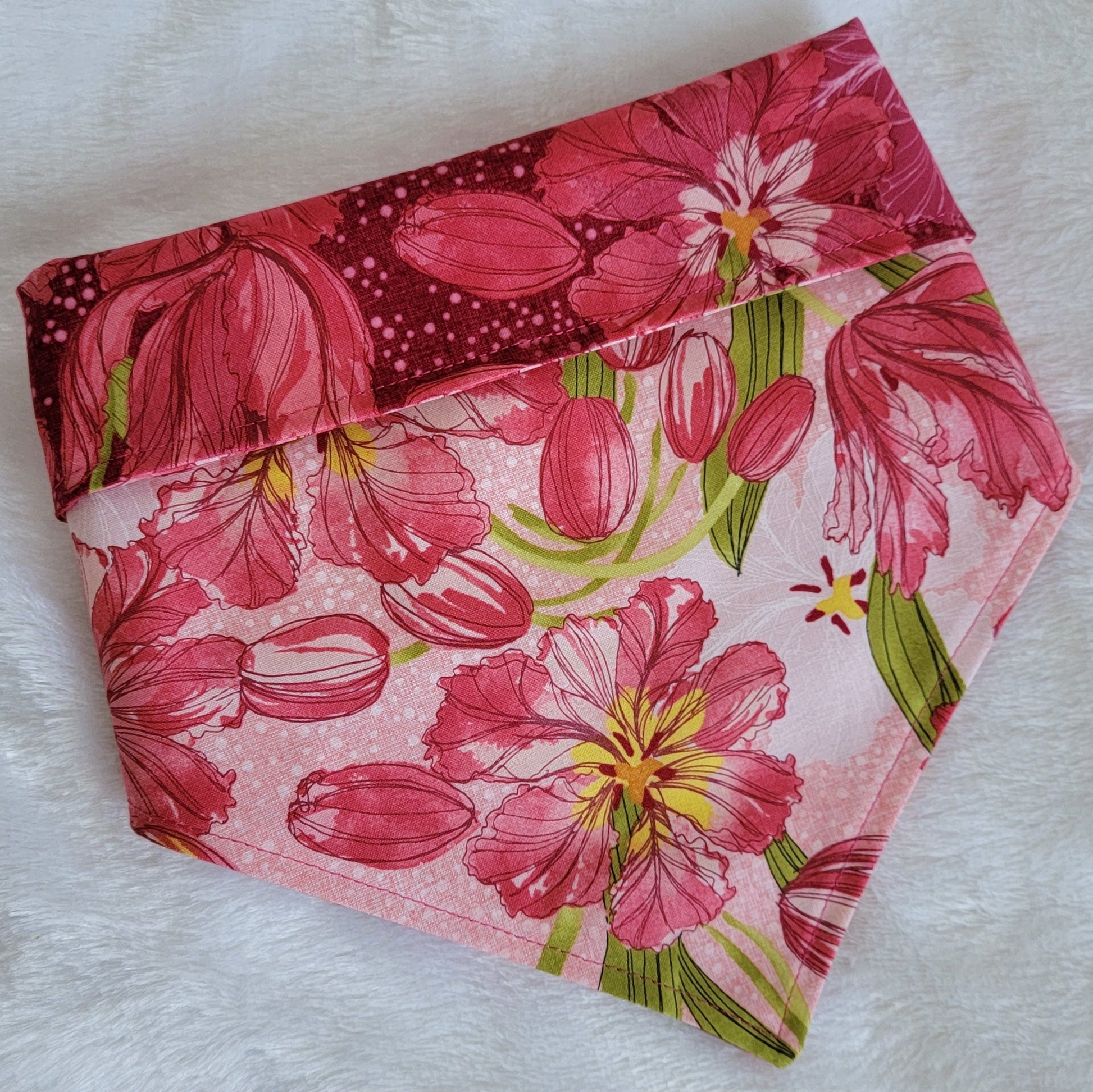 Reversible dog bandana with pink lilies print.