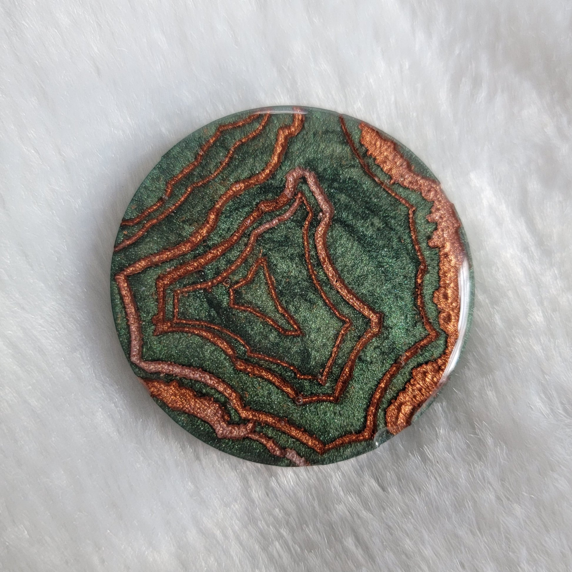 Green geode style epoxy resin piece.