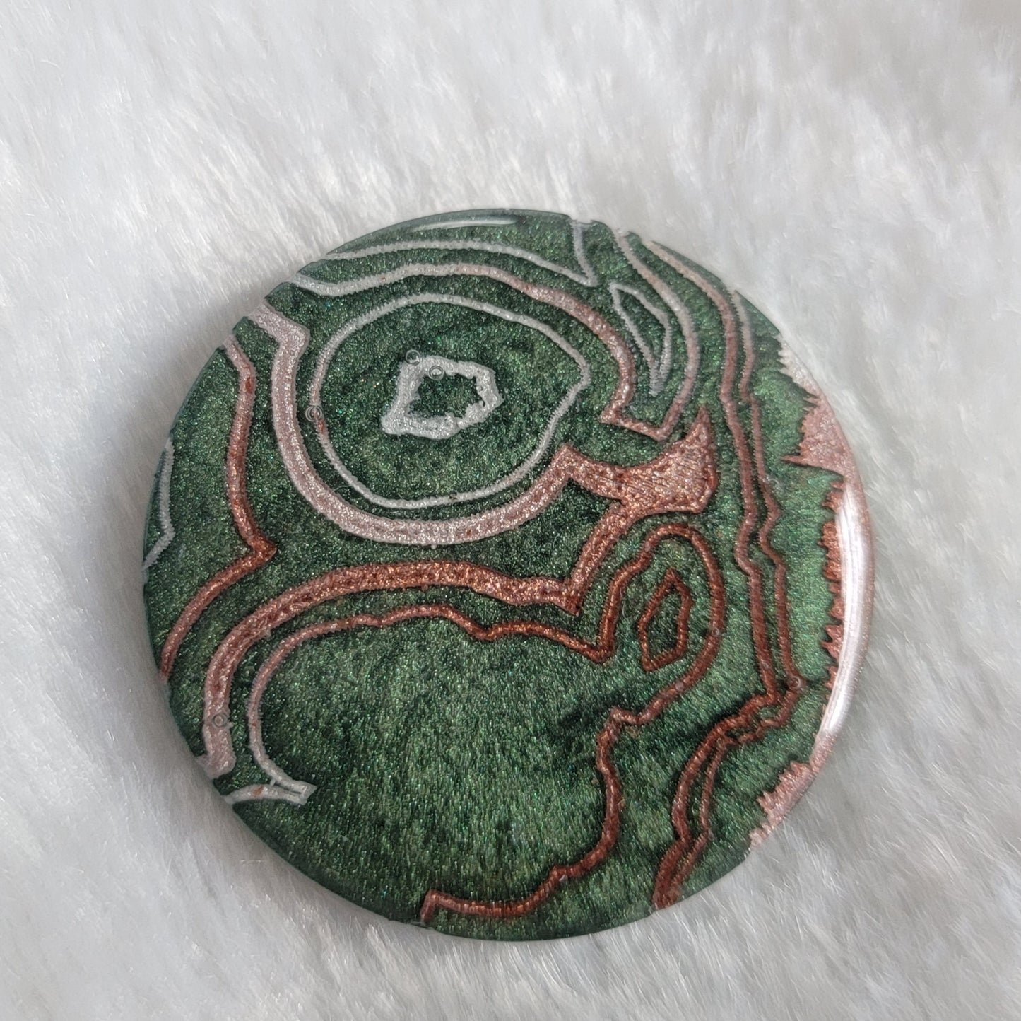 Green geode style epoxy resin piece.