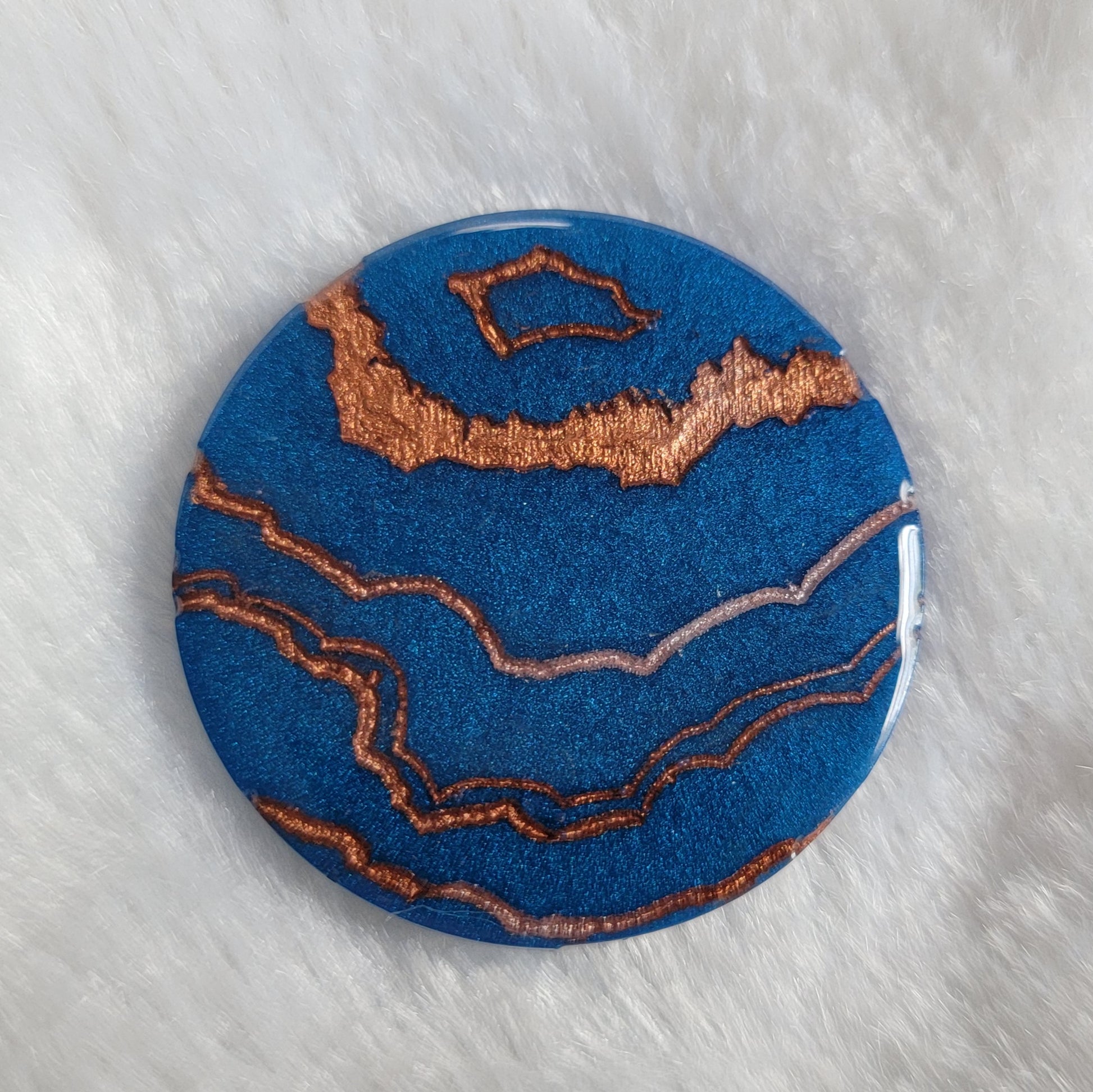 Blue geode style epoxy resin piece.