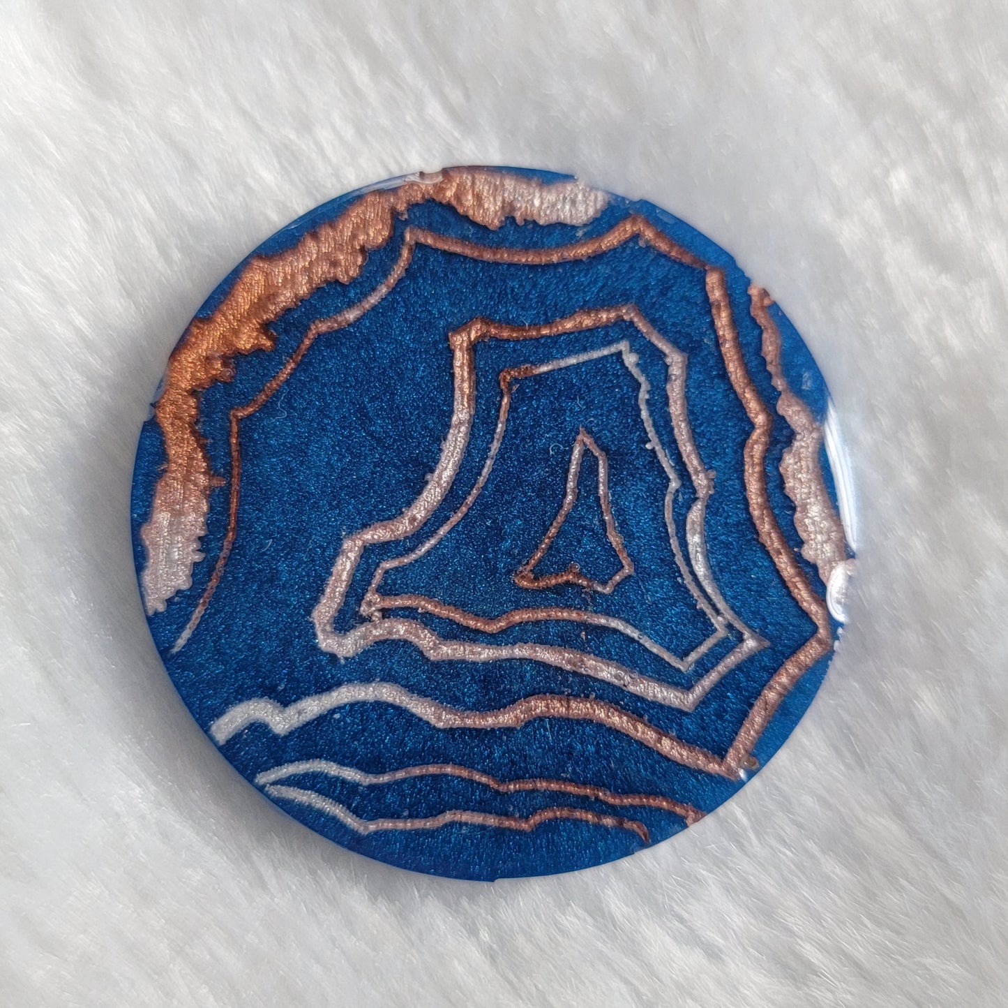 Blue geode style epoxy resin piece.