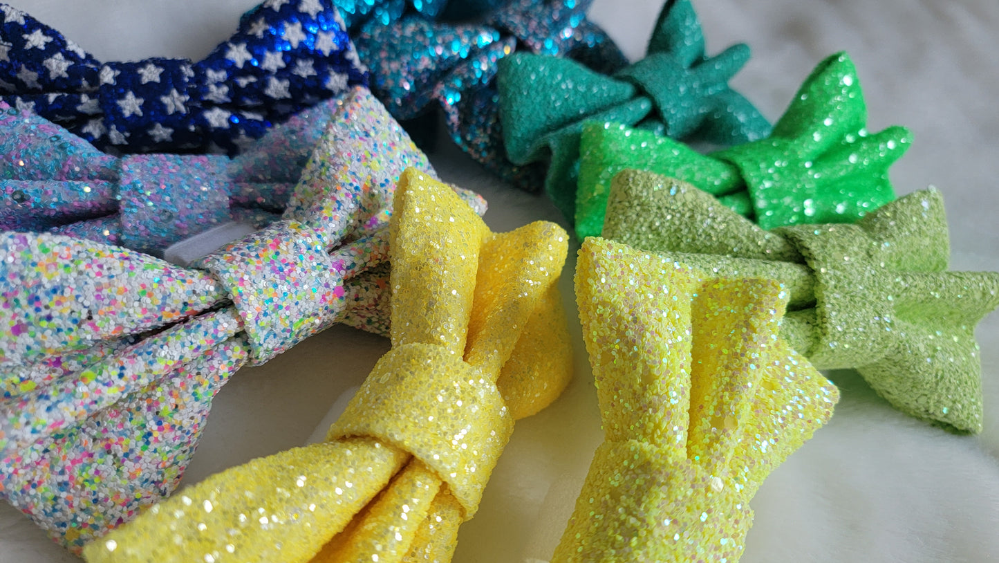 Bows made from glitter canvas in bright summery colors.