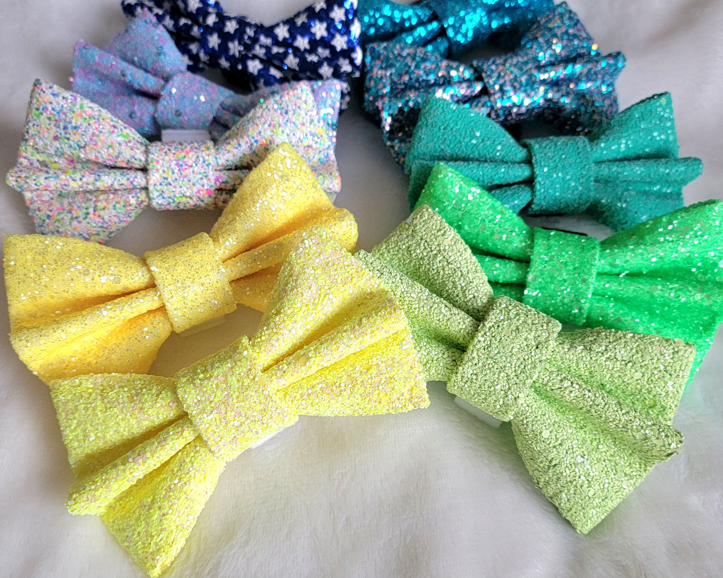 Bows made from glitter canvas in bright summery colors.