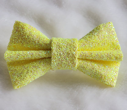 Iridescent yellow glitter canvas bow.