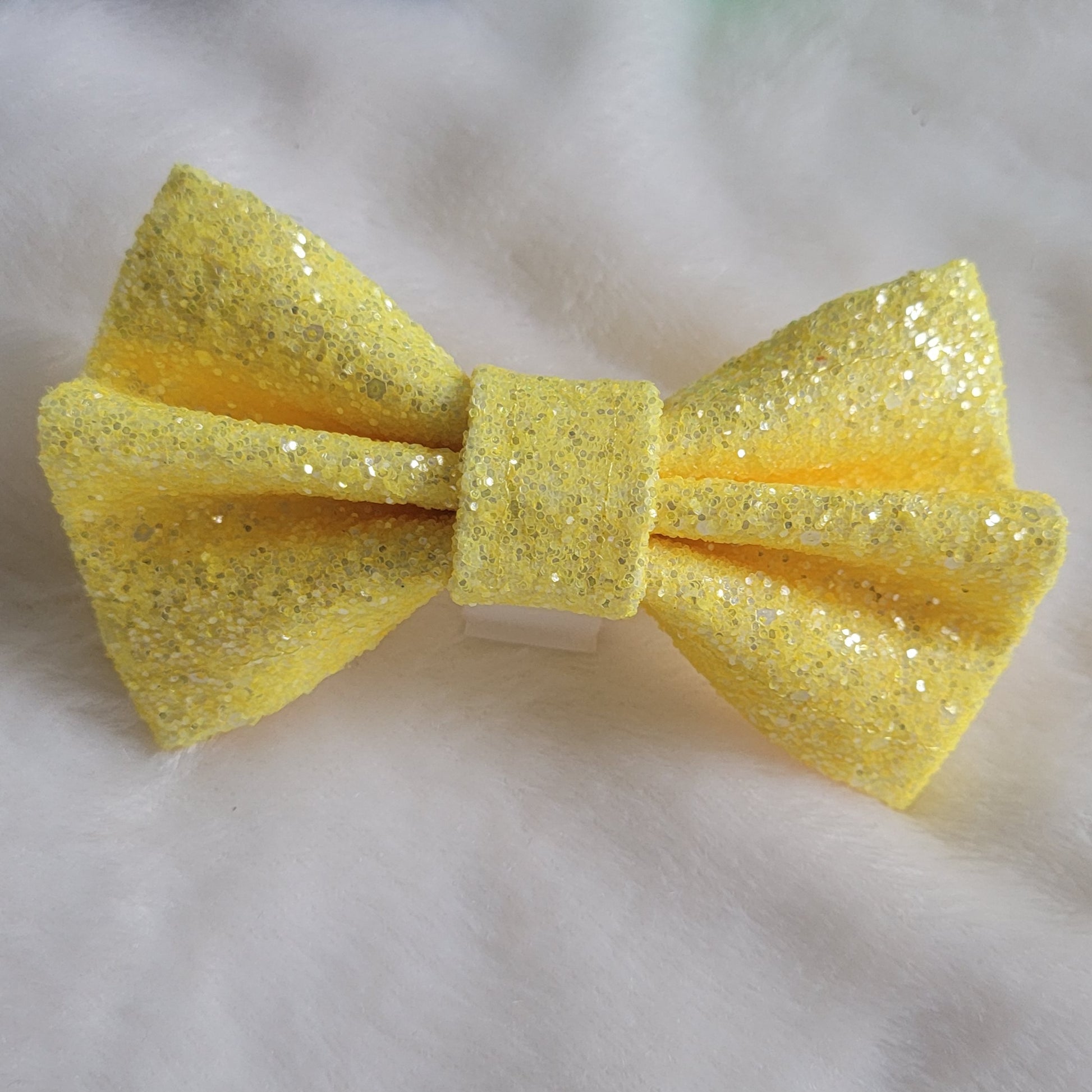 Sparkly yellow glitter canvas bow.