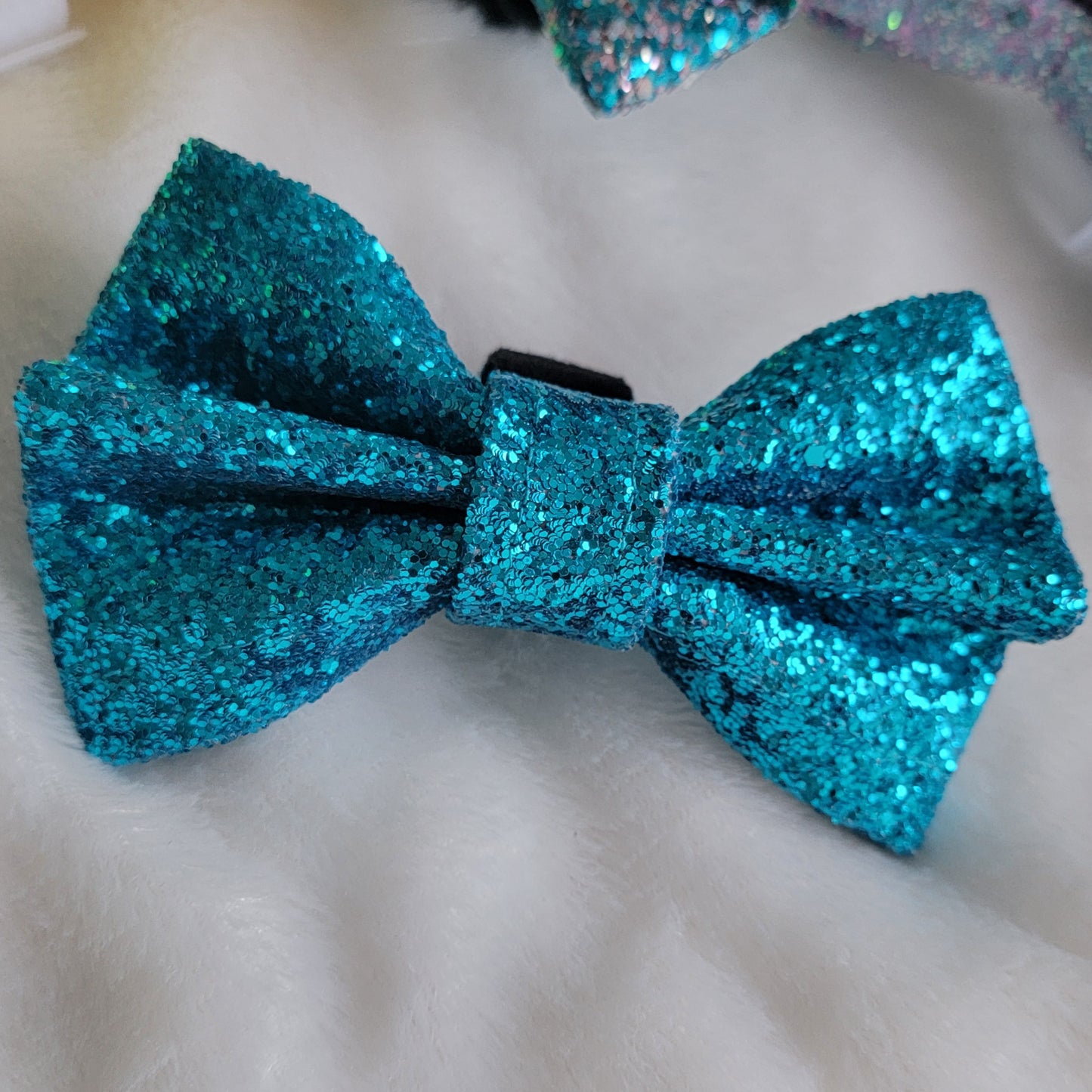 Rich teal glitter canvas bow.