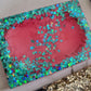 Square epoxy resin soap dish with vibrant magenta mica pigment and holographic blue butterfly glitter.