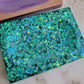 Square epoxy resin soap dish filled with blue holographic butterfly glitter.