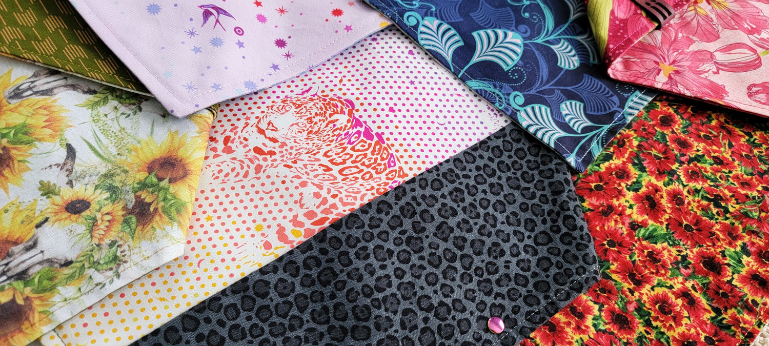 Fabric bandanas shown in several prints including florals, abstract geometric and animal prints.