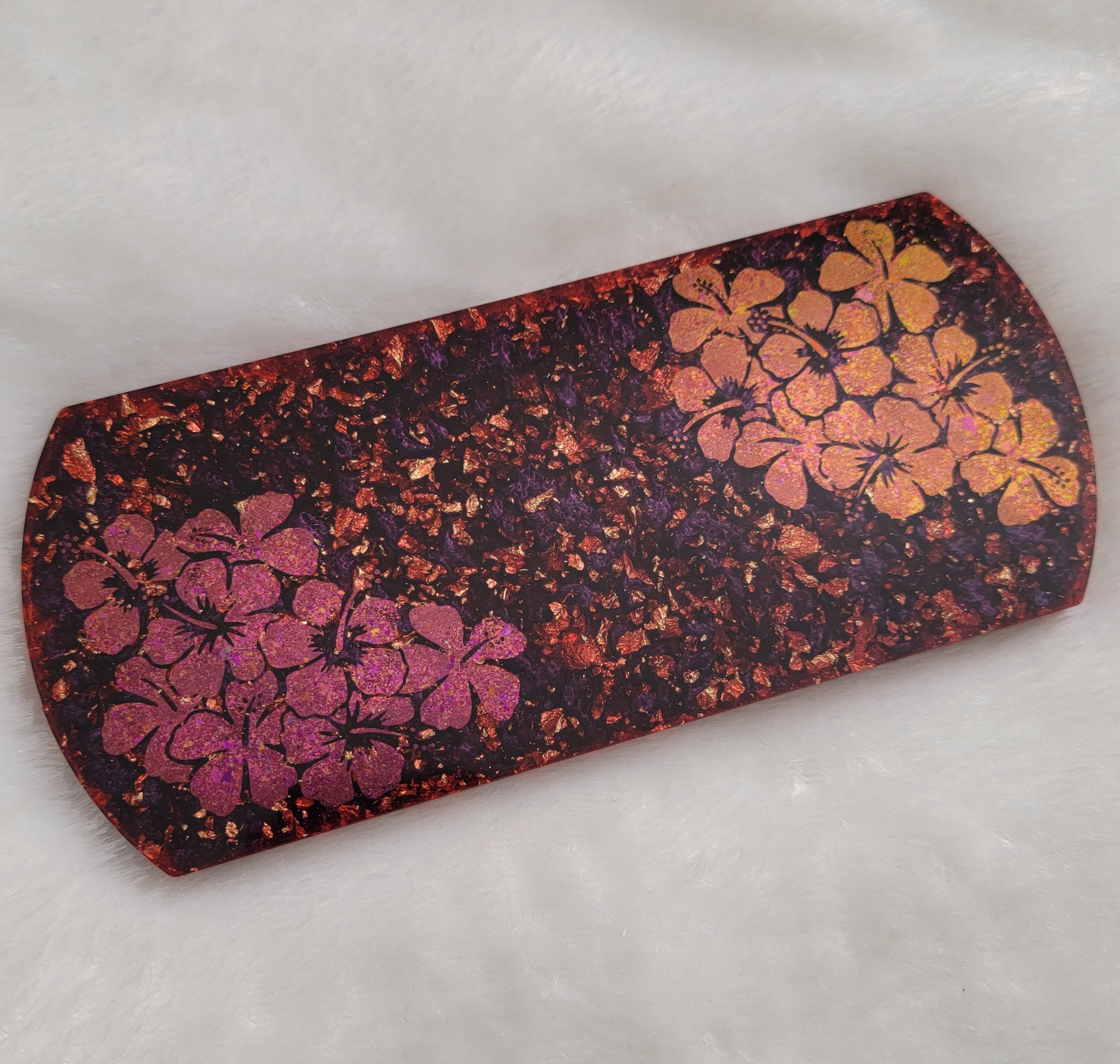 Rectangular epoxy resin piece for crate tag or home decor, rounded ends with deep plum purple and fold flake base and pink/gold hibiscus design.