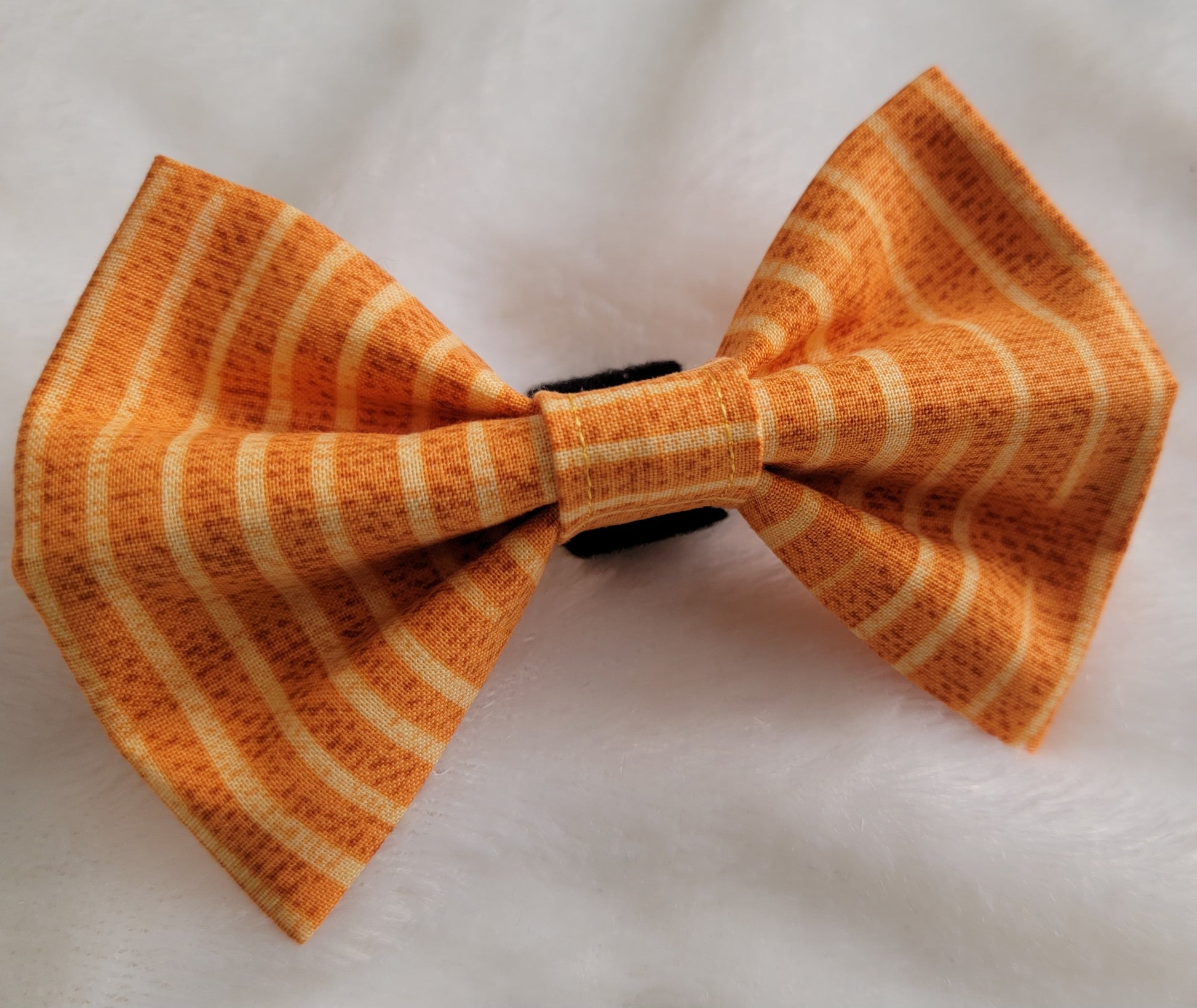 Warm golden tan striped fabric bowtie.