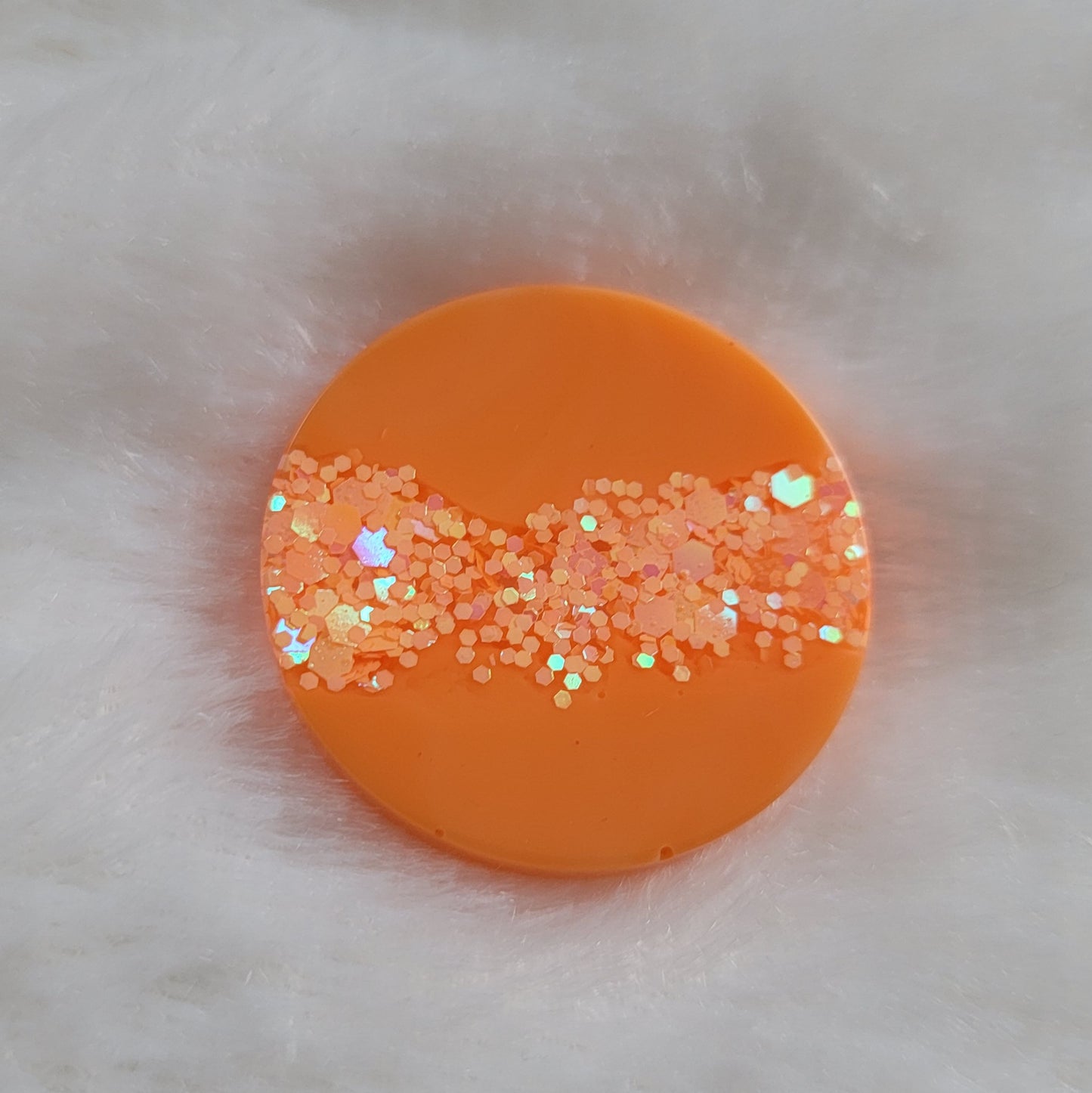 Bright neon orange epoxy resin piece with bright orange glitter stripe in the center.