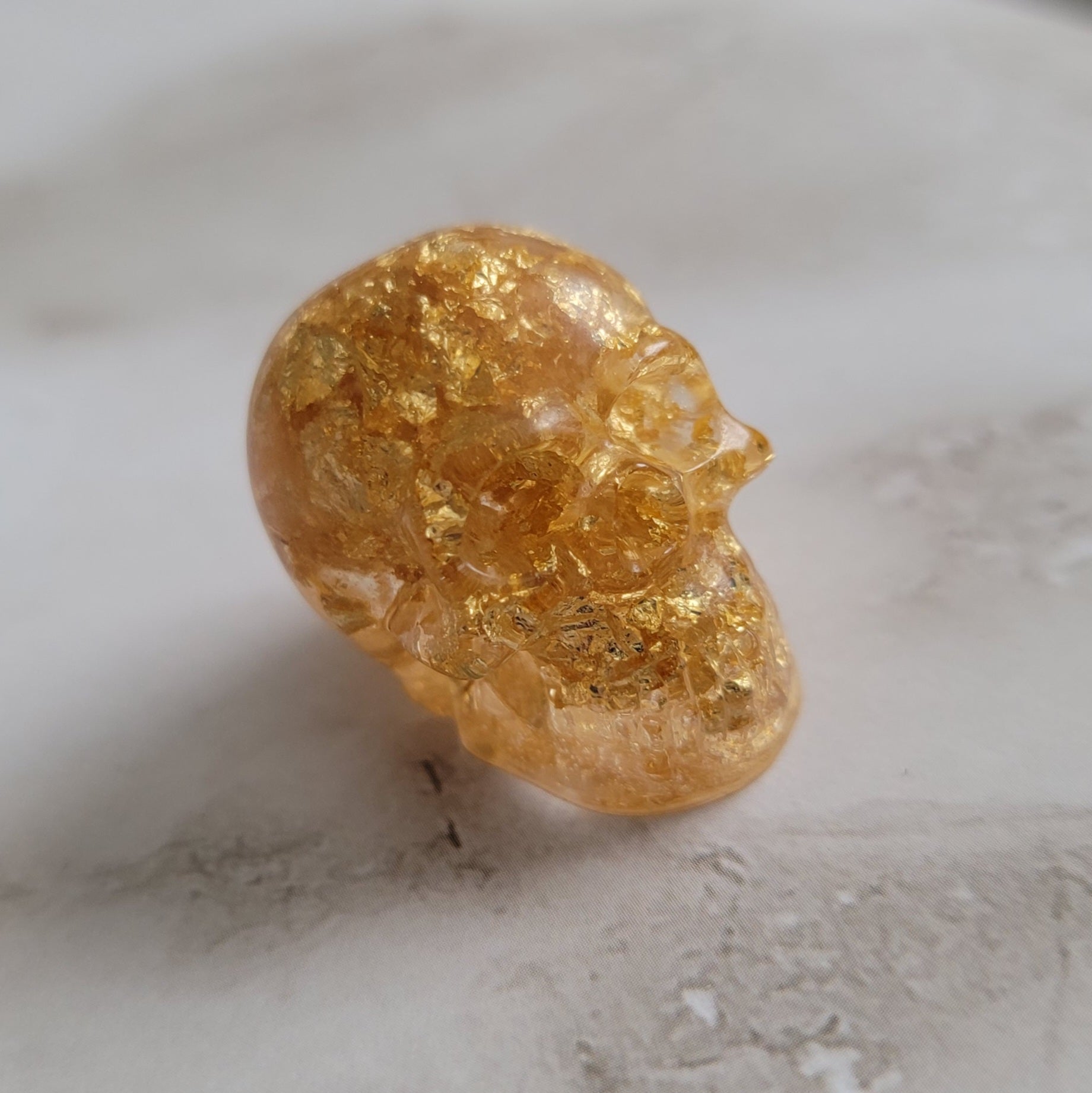 Small gold foil flake epoxy resin skull.