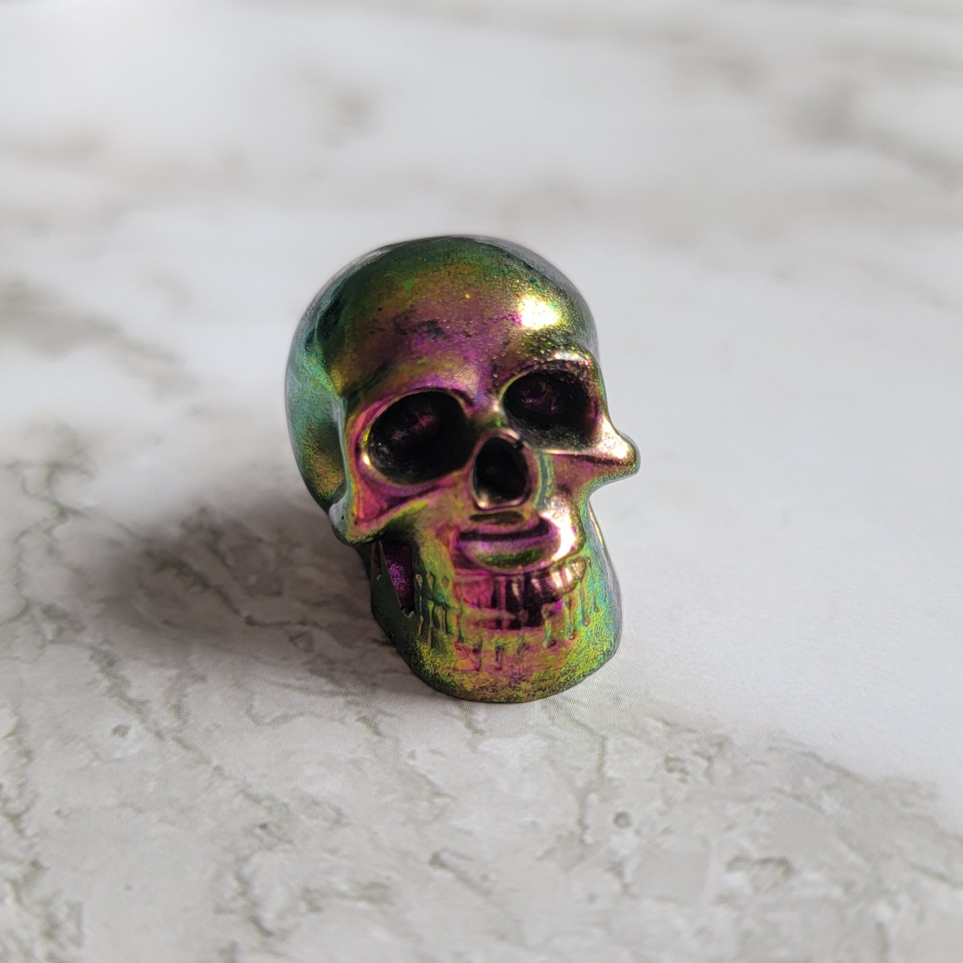 Small fuchsia-green chameleon pigment epoxy resin skull.