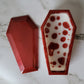 Coffin shaped epoxy resin trinket box, red and white blood drip design.