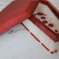 Coffin shaped epoxy resin trinket box, red and white blood drip design.