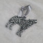 Wolf shaped epoxy resin ornament, made with bright silver glitter and a silver ribbon attached.