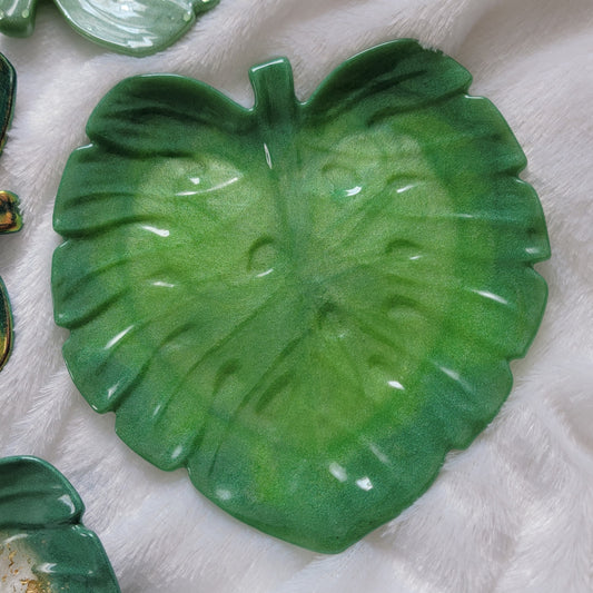 Monstera leaf shaped decorative dish made from epoxy resin, bright grass green fades into slightly darker green edges.