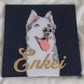 Portrait of a grey and white husky dog made with vinyl on a navy blue canvas background, sealed in epoxy resin with chrome gold vinyl name "Enkei" across the front.