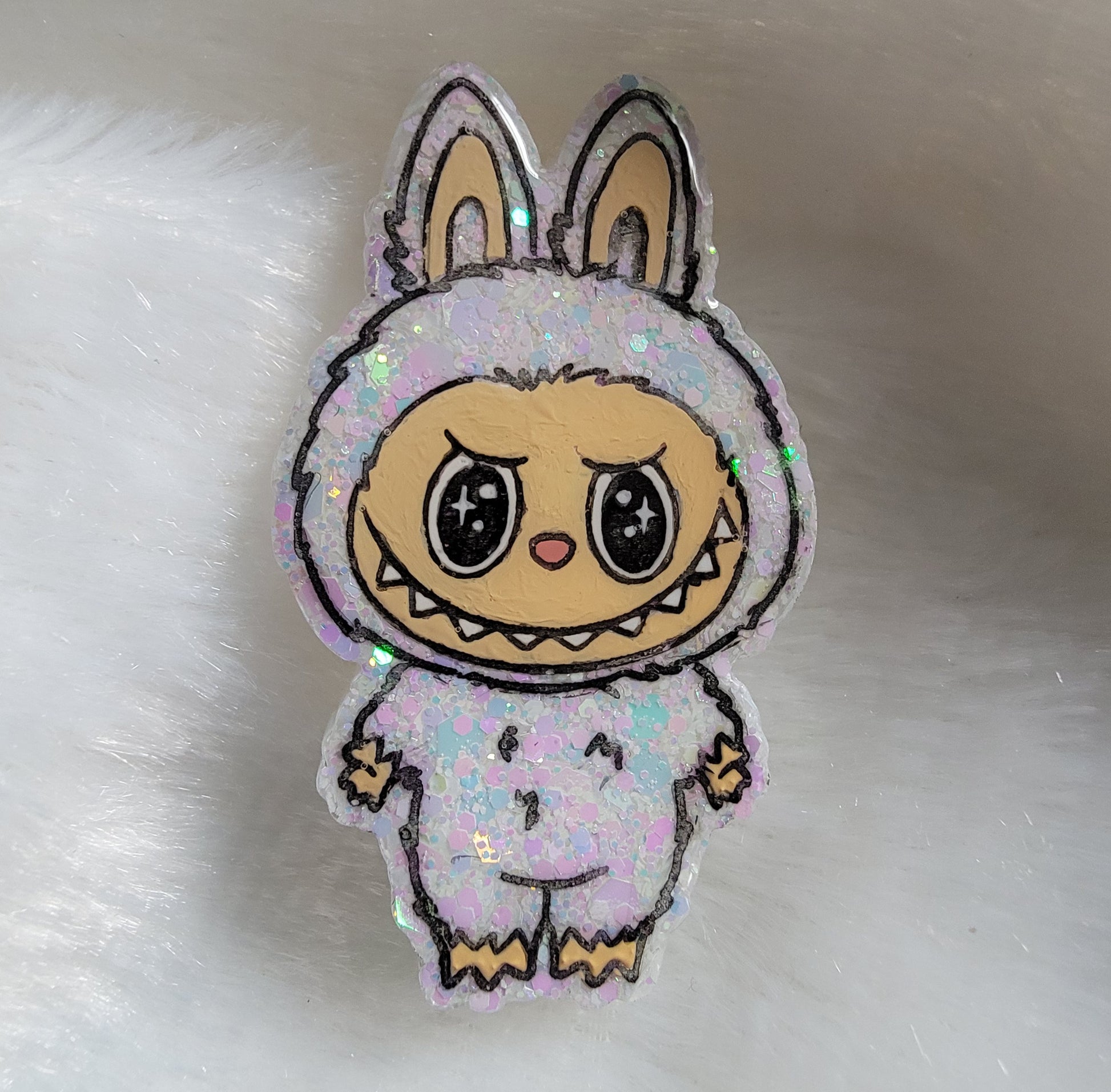 Labubu inspired epoxy resin pet tag, made with white iridescent glitter and acrylic painted details.