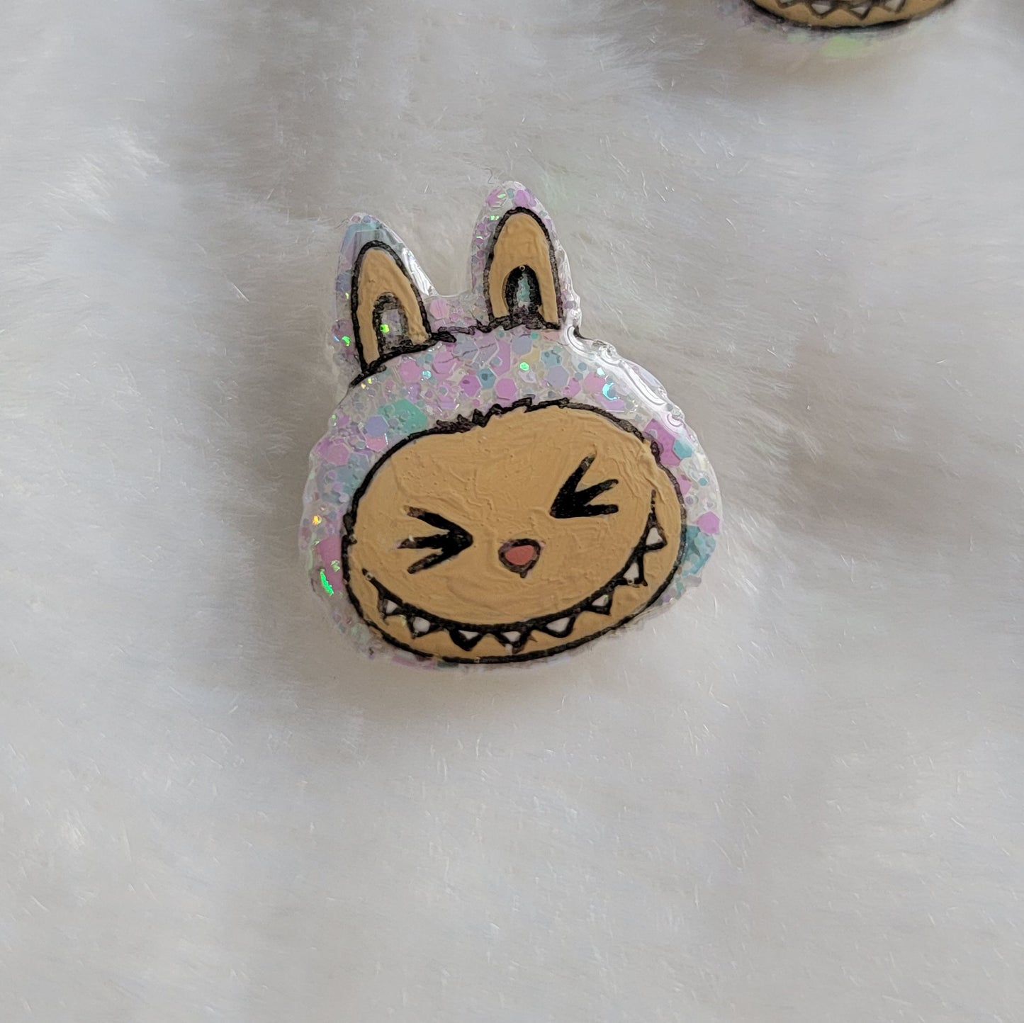 Labubu inspired small epoxy resin pet tag, made with white iridescent glitter and acrylic painted details.