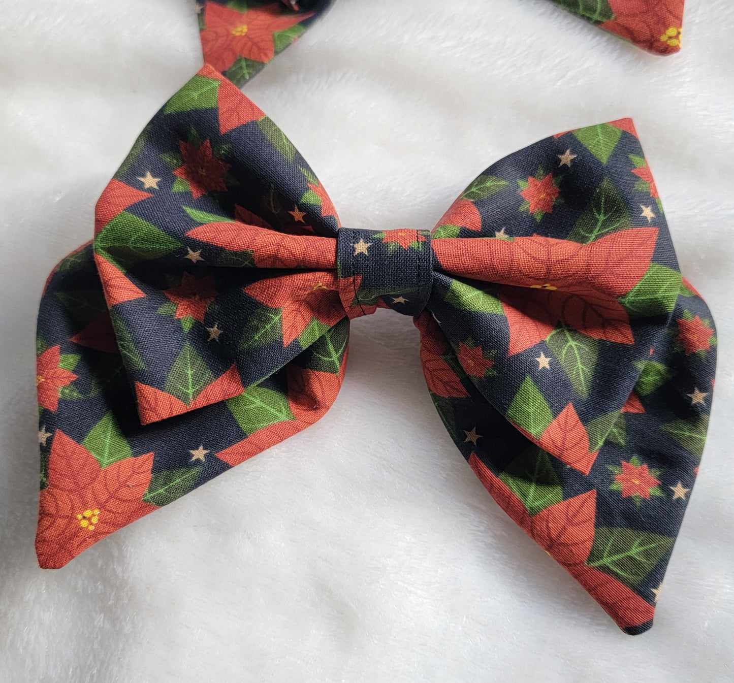 Large sailor bow made with poinsettia print cotton, displayed on a white background.