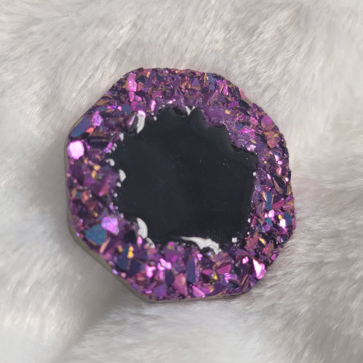 Octagon shaped epoxy resin piece with purple crystal texture border and black center, displayed on a white background.